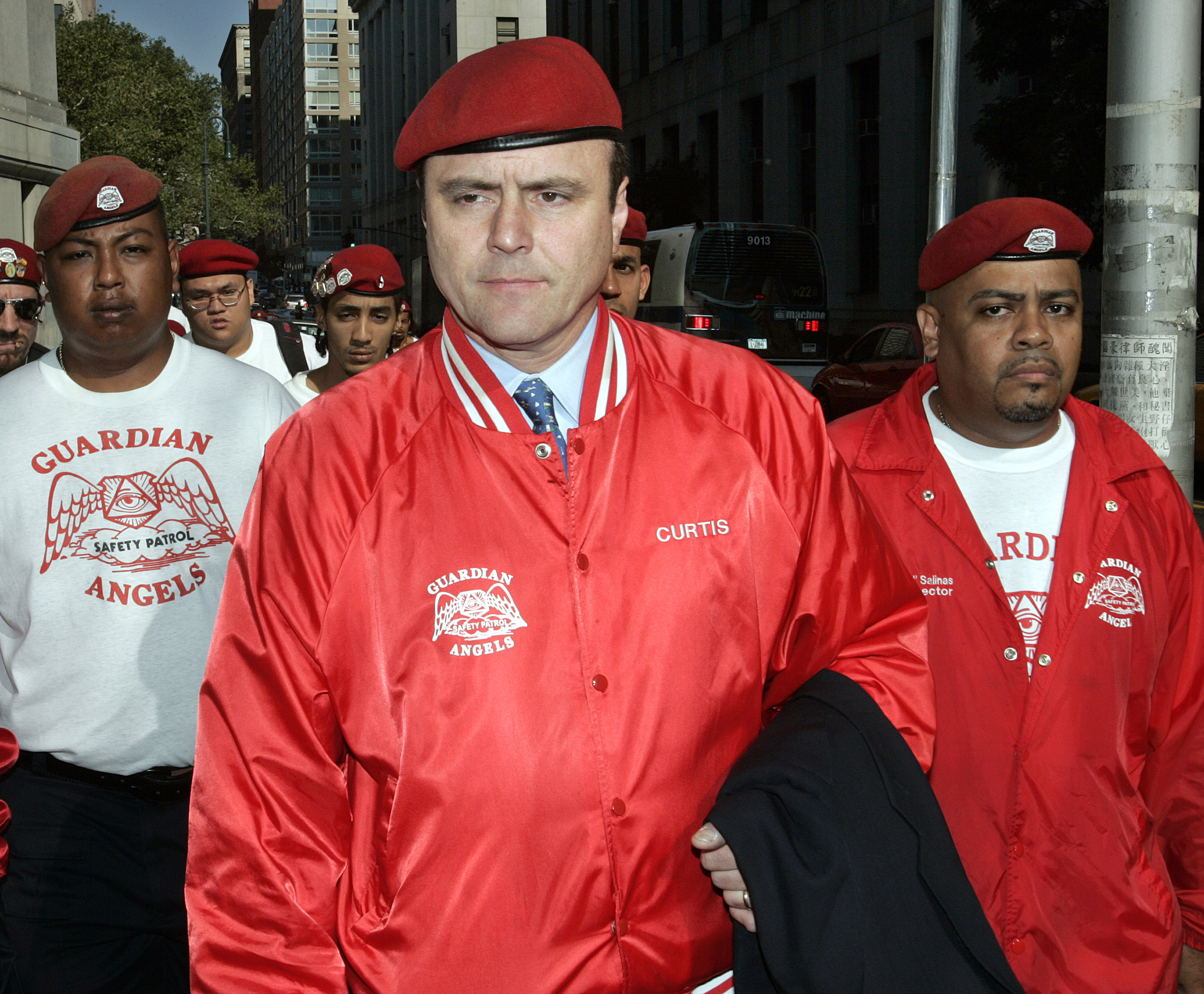 Trailed by Guardian Angels, Curtis Sliwa arrives at federal court to testify in the trial of alleged mobster John Gotti Jr. August 22, 2005 in New York City. Gotti Jr. is accused of a conspiracy to kidnap Sliwa as part of a slew of racketeering charges that could jail him for up to 30 years. (Photo by Stephen Chernin/Getty Images)