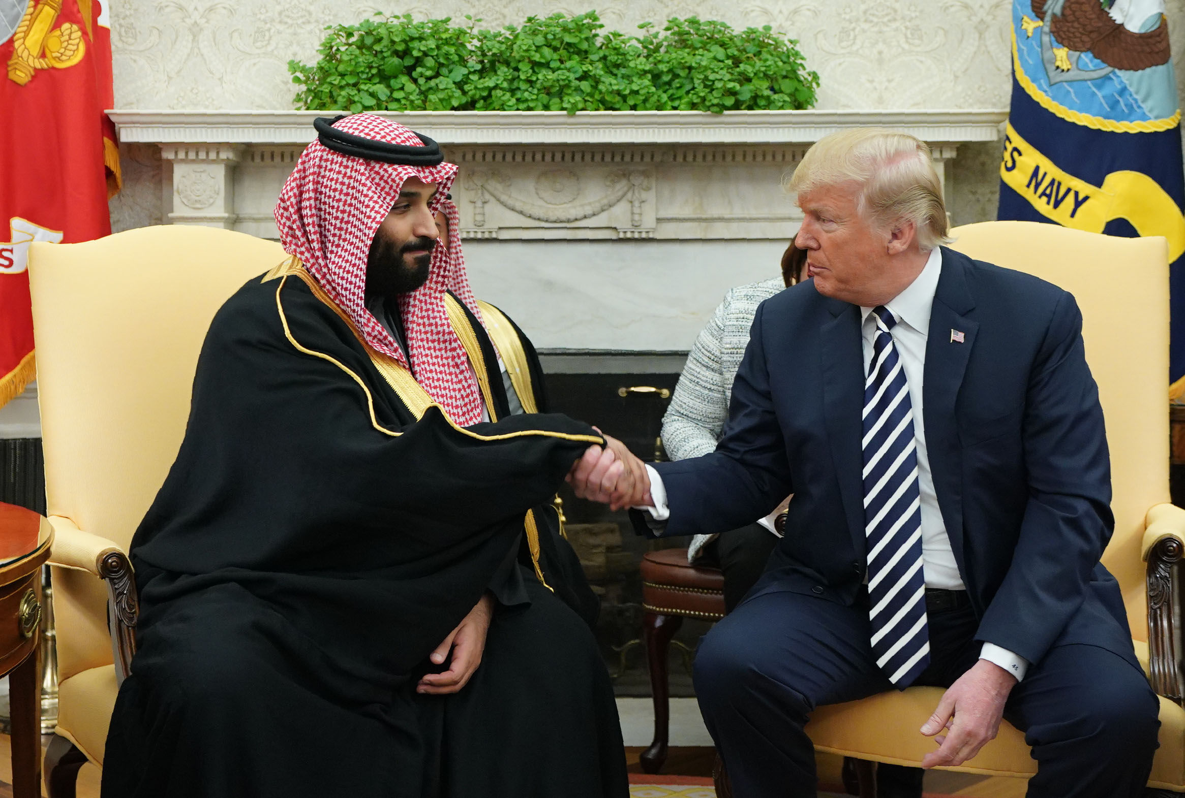 US President Donald Trump (R) shakes hands with Saudi Arabia's Crown Prince Mohammed bin Salman in the Oval Office of the White House on March 20, 2018 in Washington, DC. (Photo by MANDEL NGAN / AFP) (Photo credit should read MANDEL NGAN/AFP via Getty Images)