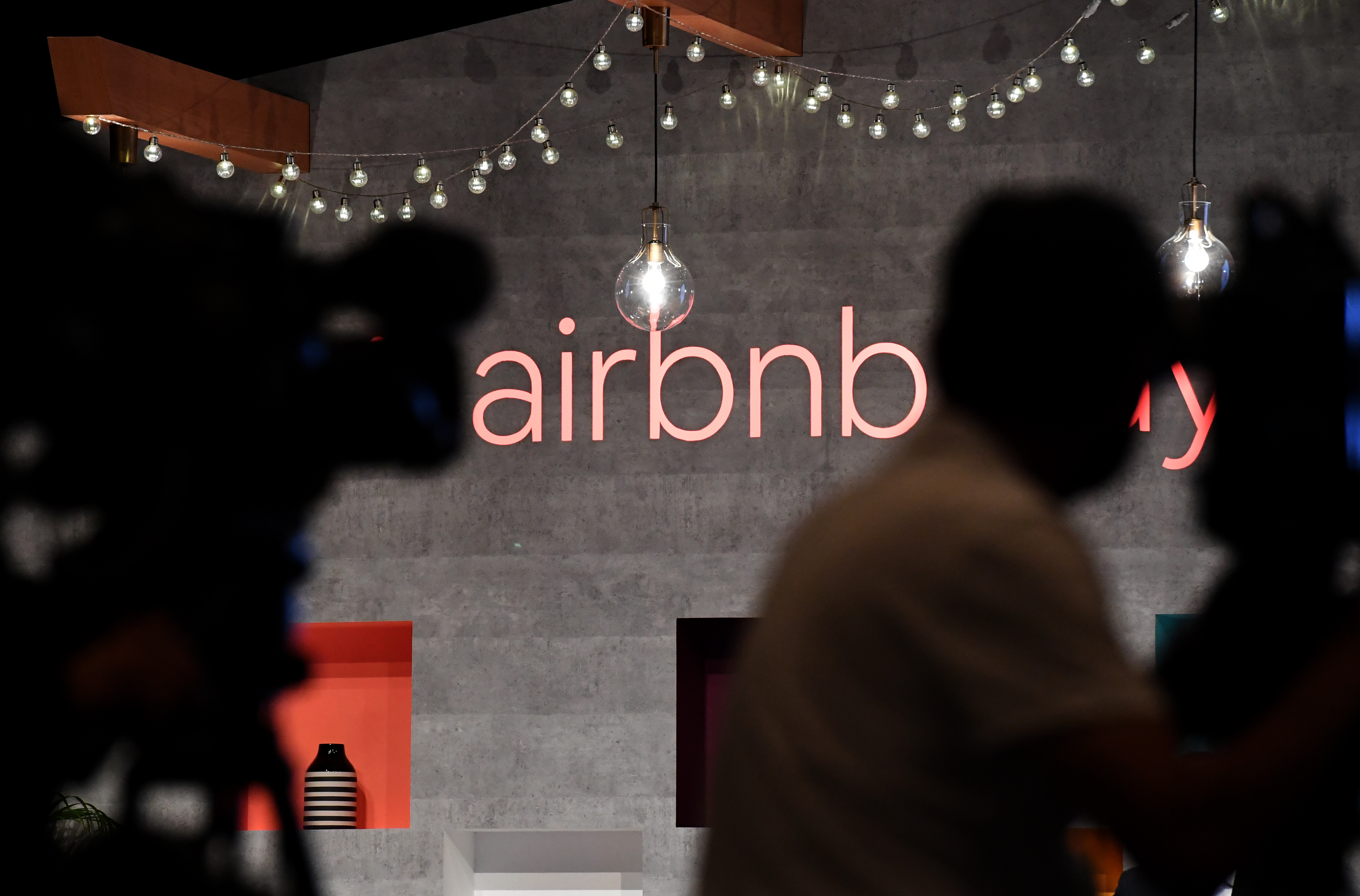 The US rental site Airbnb logo is displayed during the company's press conference in Tokyo on June 14, 2018. (Photo by Toshifumi Kitamura/AFP via Getty Images)