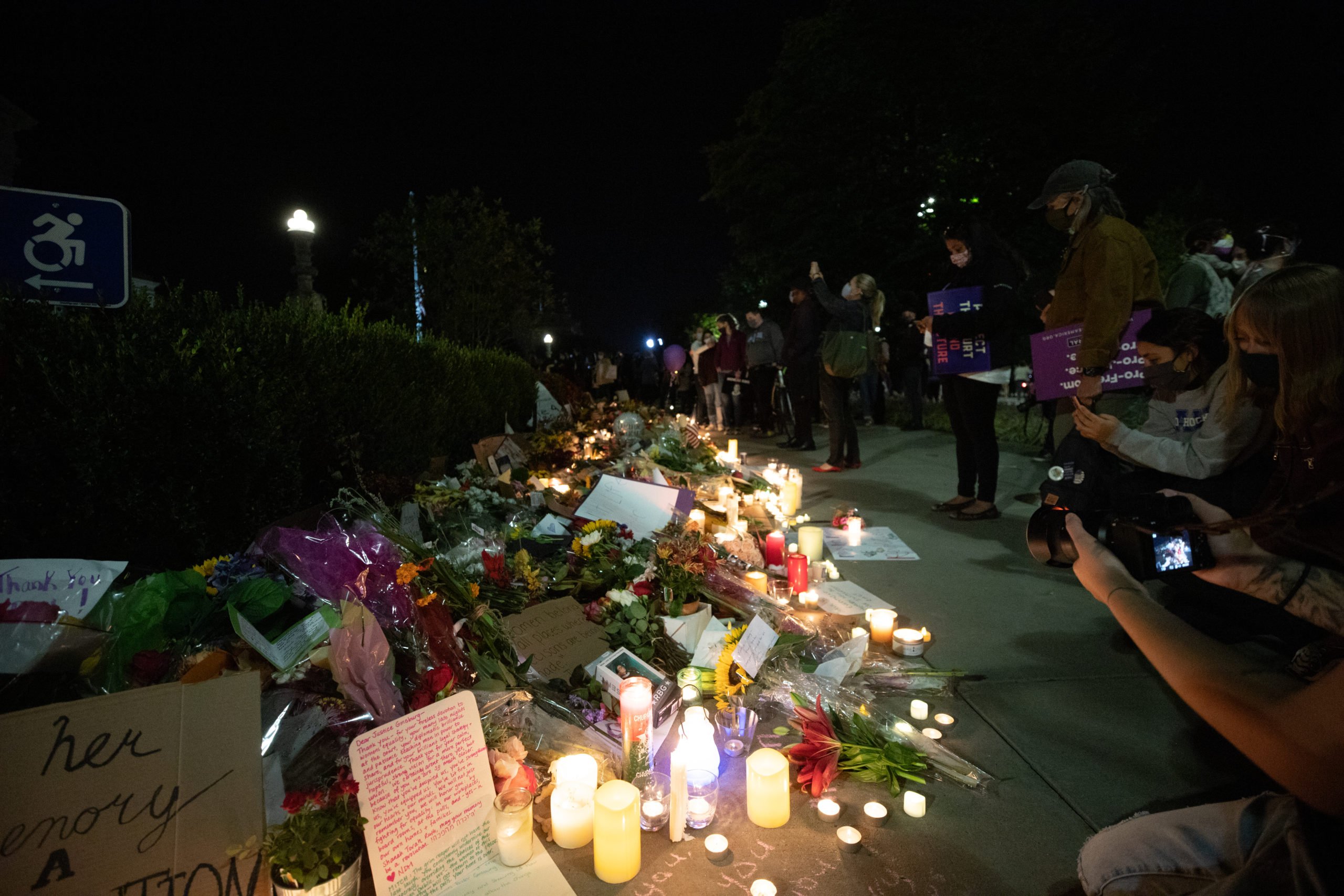 The flowers, candles, signs, and memorabilia stretched around the bushes in front of the Supreme Court at a memorial honoring the late Justice Ruth Bader Ginsburg on Sept. 19, 2020. (Photo: Kaylee Greenlee / The DCNF)