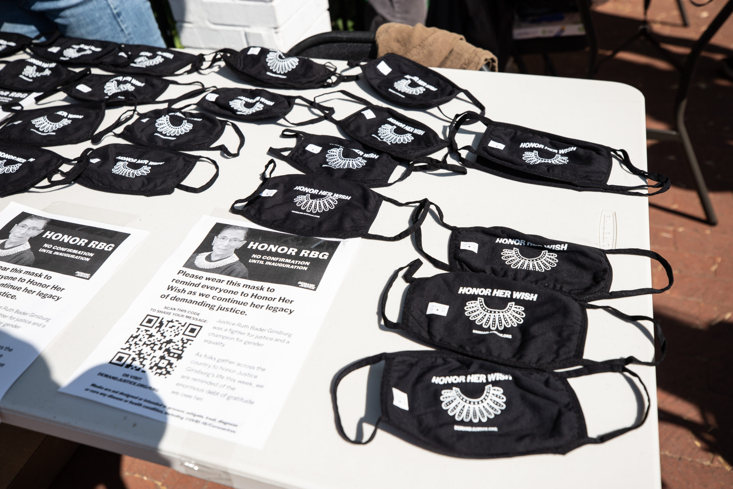 People gave away free masks that said "honor her wish" -- referring to Ruth Bader Ginsburg's wish that her seat be filled by the next elected president, on Sept. 23, 2020. (Photo: Kaylee Greenlee / DCNF) 