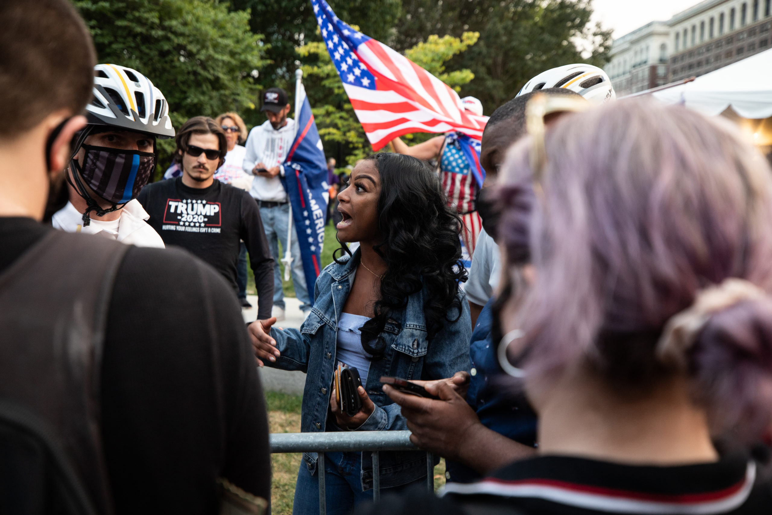A Trump supporter tells an officer that protesters stole her black "Keep America Great" hat off of her head in Philadelphia, Pennsylvania on Sept. 15, 2020. (Photo: Kaylee Greenlee / DCNF)
