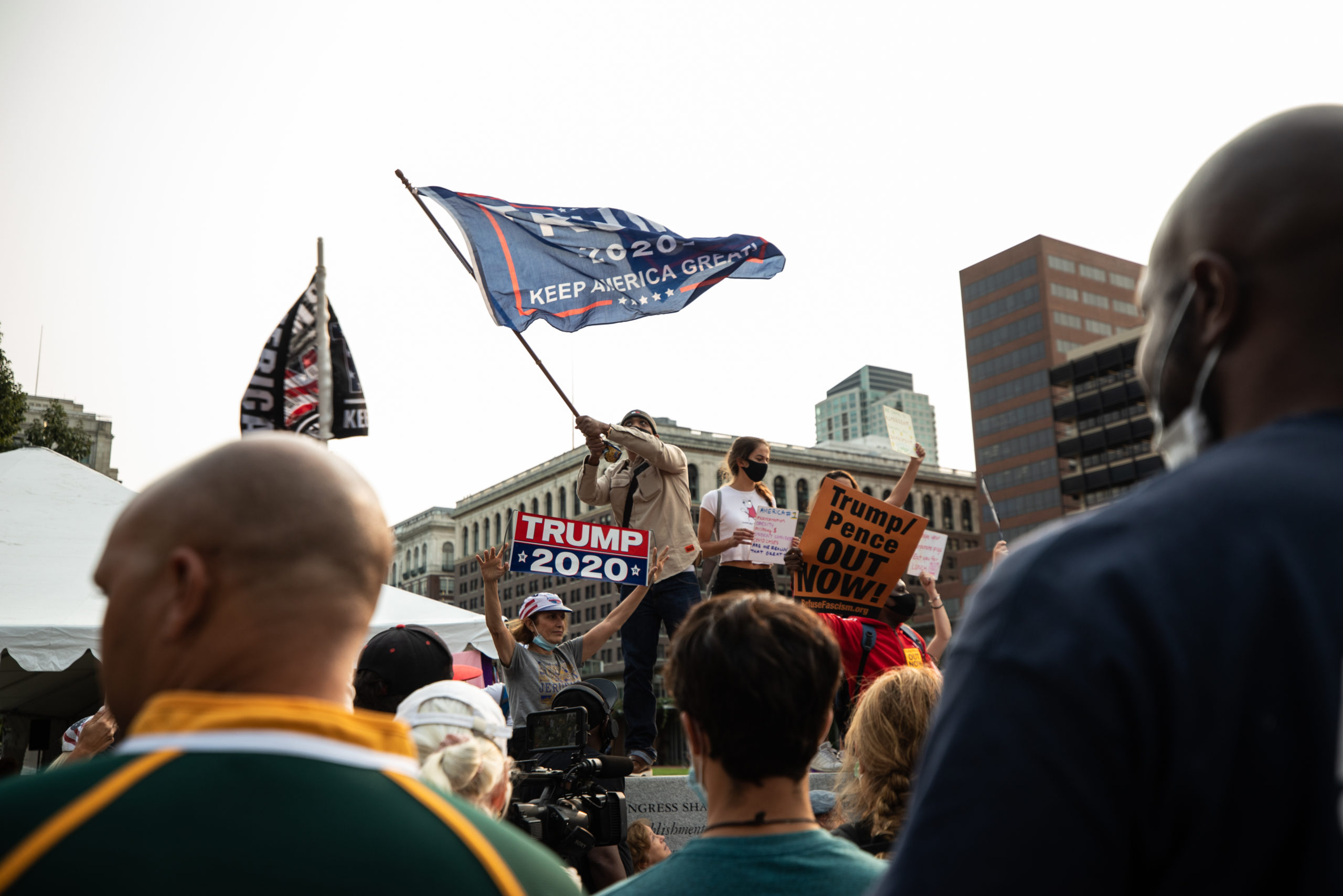 Trump supporters wave a "Trump 2020" flag while standing on an elevated surface in Philadelphia, Pennsylvania on Sept. 15, 2020. (Photo: Kaylee Greenlee / DCNF)