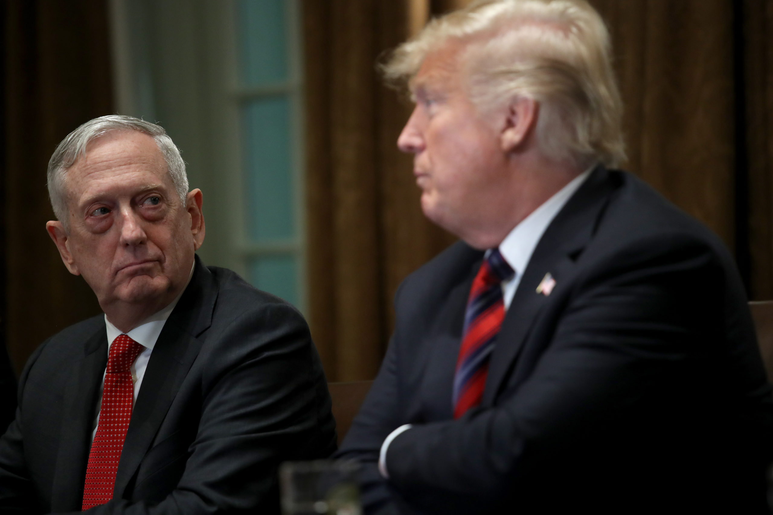 WASHINGTON, DC - OCTOBER 23: U.S. Defense Secretary Jim Mattis listens as U.S. President Donald Trump answers questions during a meeting with military leaders in the Cabinet Room on October 23, 2018 in Washington, DC. Trump discussed a range of issues while press were in the room including current relations with Saudi Arabia, and the use of the U.S. military in protecting the borders of the United States. (Photo by Win McNamee/Getty Images)