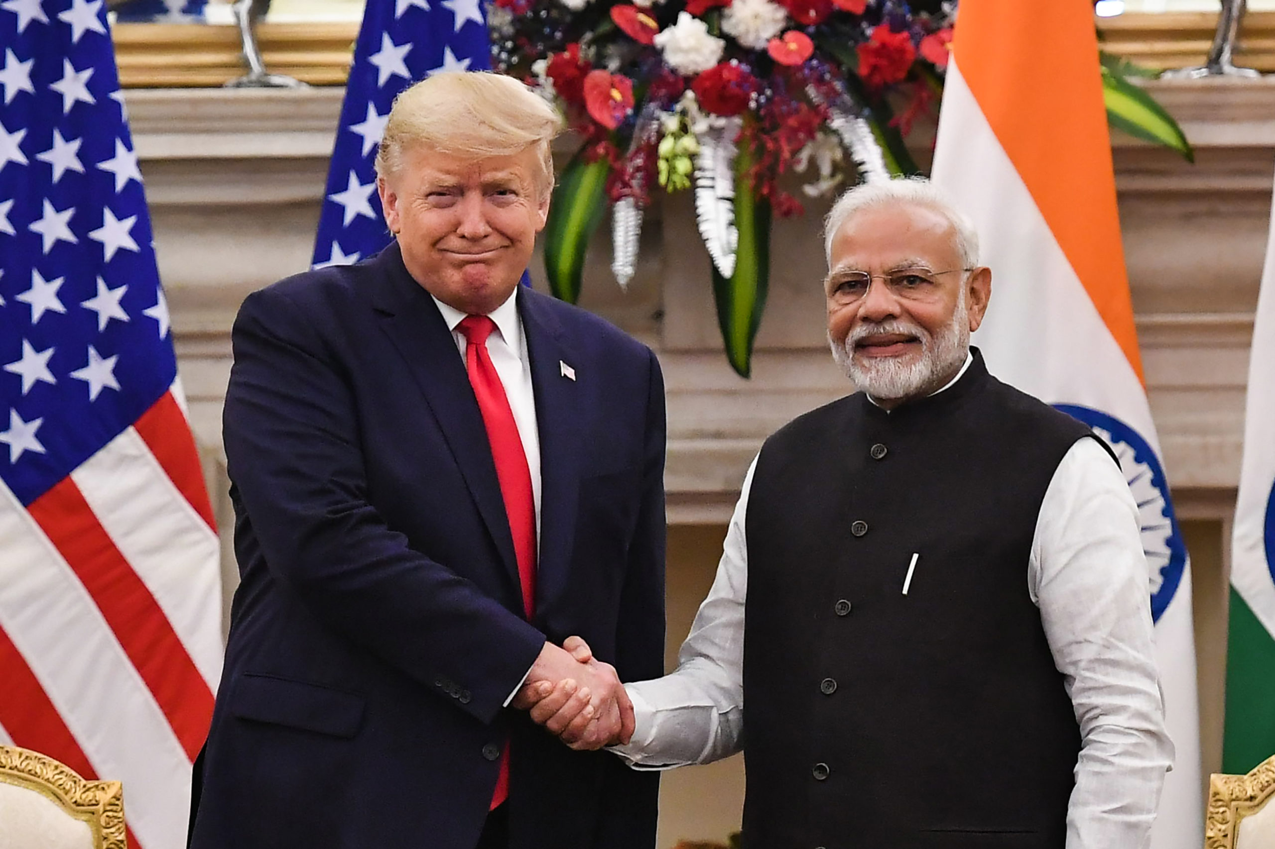 India's Prime Minister Narendra Modi (R) shakes hands with US President Donald Trump before a meeting at Hyderabad House in New Delhi on February 25, 2020. (Photo by Mandel NGAN / AFP) (Photo by MANDEL NGAN/AFP via Getty Images)