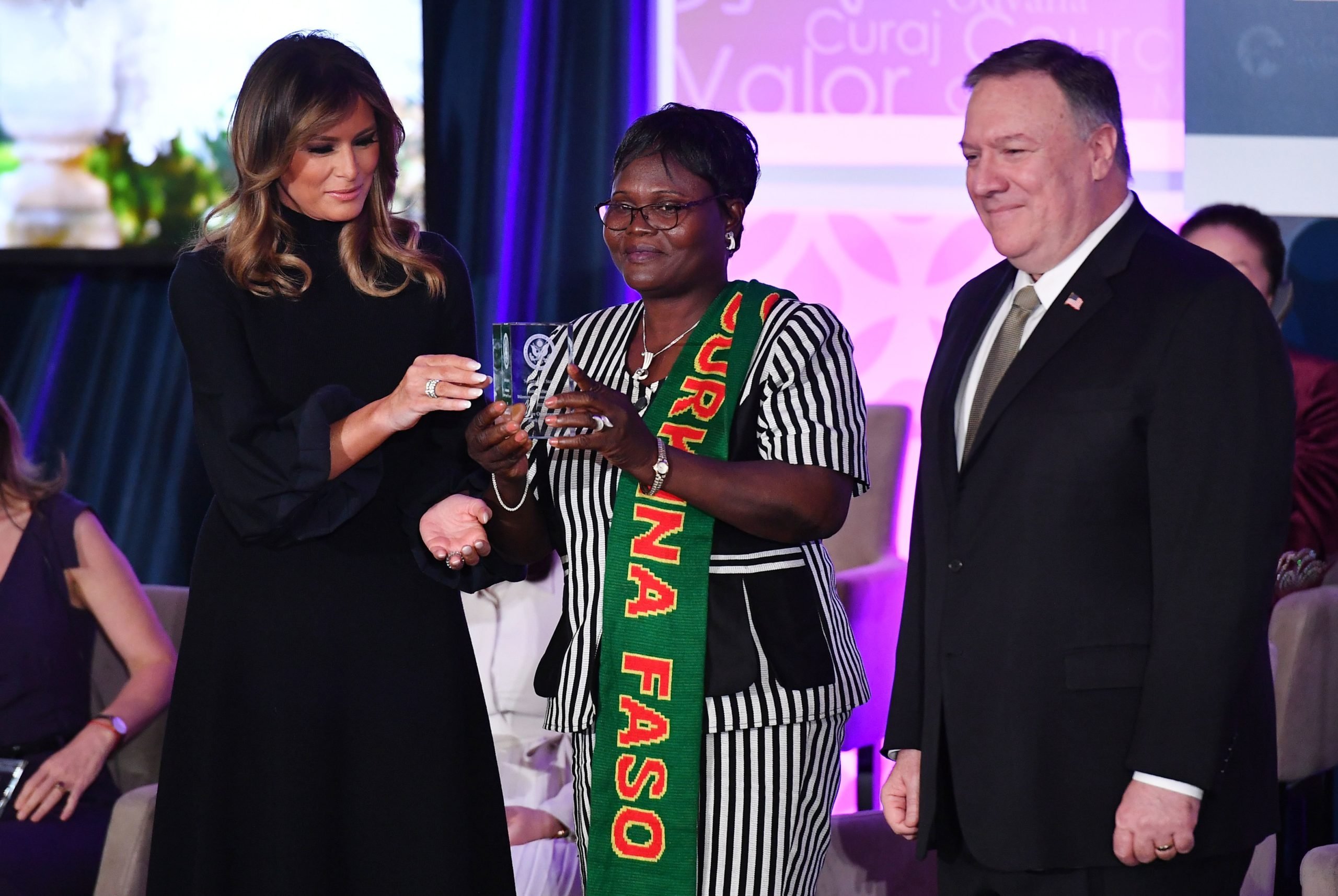 International Women of Courage (IWOC) Award recipient Claire Ouedraogo of Burkina Faso poses with US Secretary of State Mike Pompeo and First Lady Melania Trump at the State Department in Washington, DC on March 4, 2020. (Mandel Ngan/AFP via Getty Images)