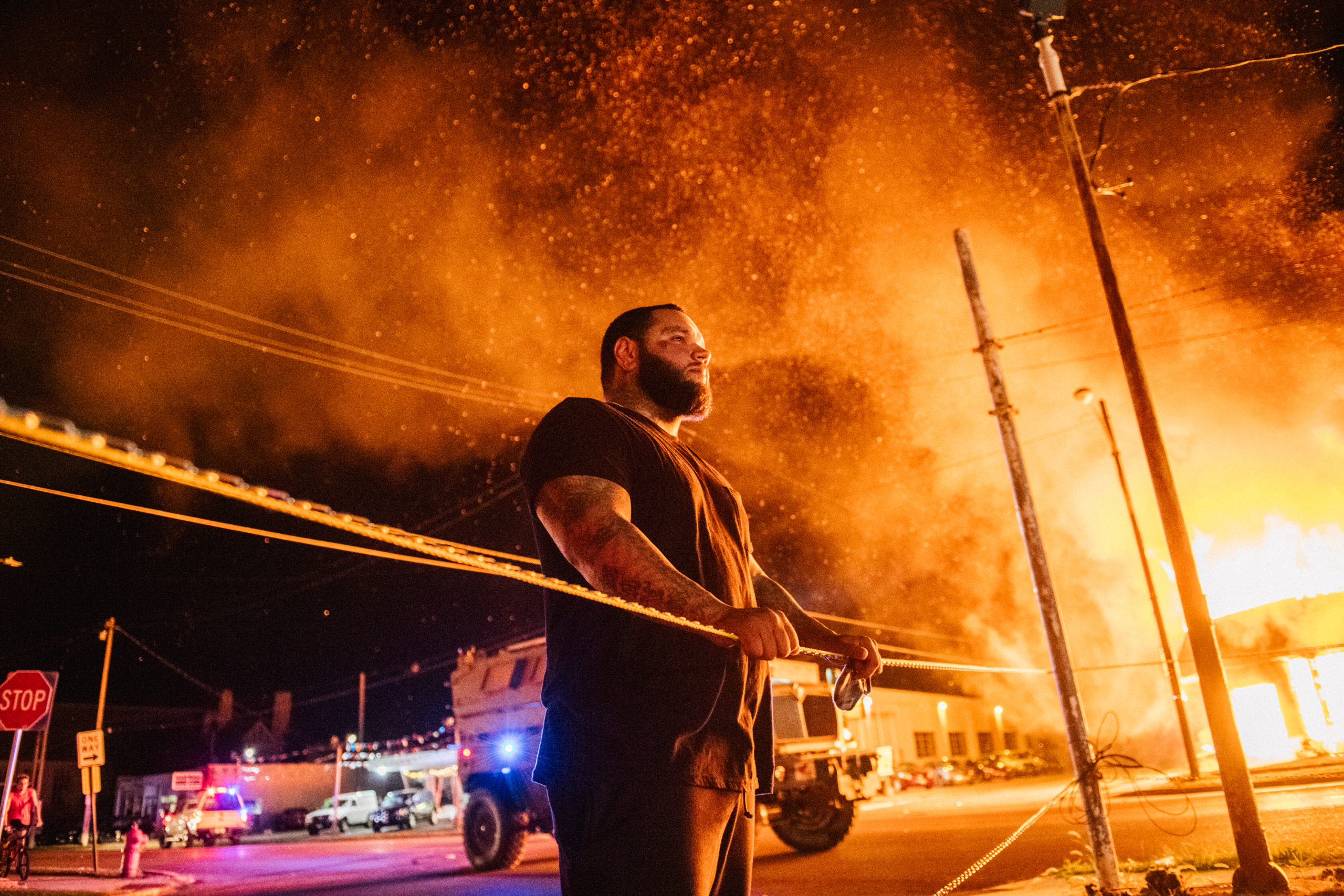 KENOSHA, WI - AUGUST 24: A man looks over caution tape during a second night of rioting on August 24, 2020 in Kenosha, Wisconsin. The civil unrest occurred after the shooting of Jacob Blake, 29, on August 23. Blake was shot multiple times in the back by Wisconsin police officers after attempting to enter into the drivers side of a vehicle. (Photo by Brandon Bell/Getty Images)