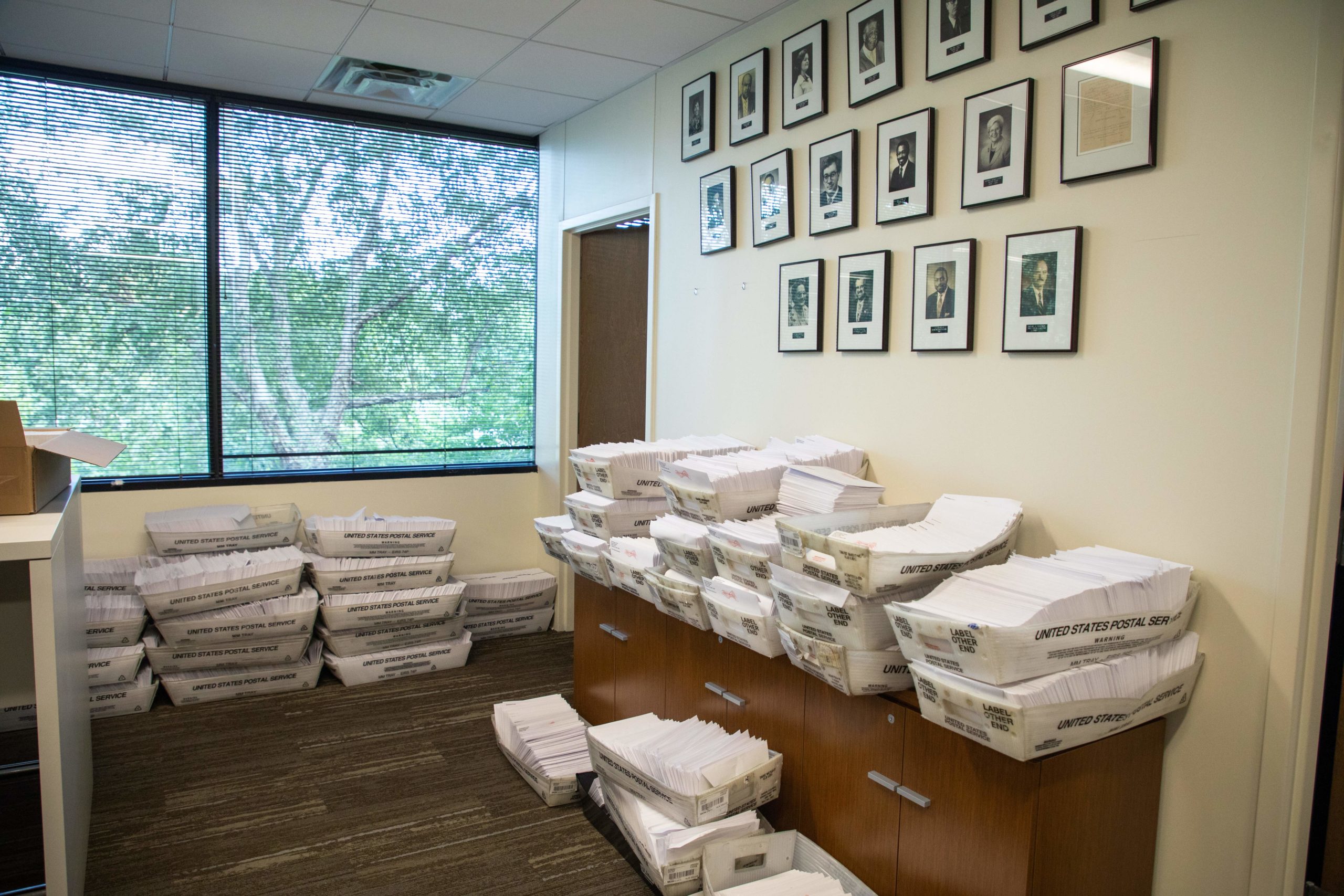 Large boxes of envelopes are seen as absentee ballot election workers stuff ballot applications at the Mecklenburg County Board of Elections office in Charlotte, North Carolina on September 4, 2020. - The US election is officially open: North Carolina on September 4, 2020 launched vote-by-mail operations for the November 3 contest between President Donald Trump and Joe Biden, which is getting uglier by the day. Worries about the unabated spread of the coronavirus are expected to prompt a major increase in the number of ballots cast by mail, as Americans avoid polling stations. (Photo by Logan Cyrus / AFP) (Photo by LOGAN CYRUS/AFP via Getty Images)