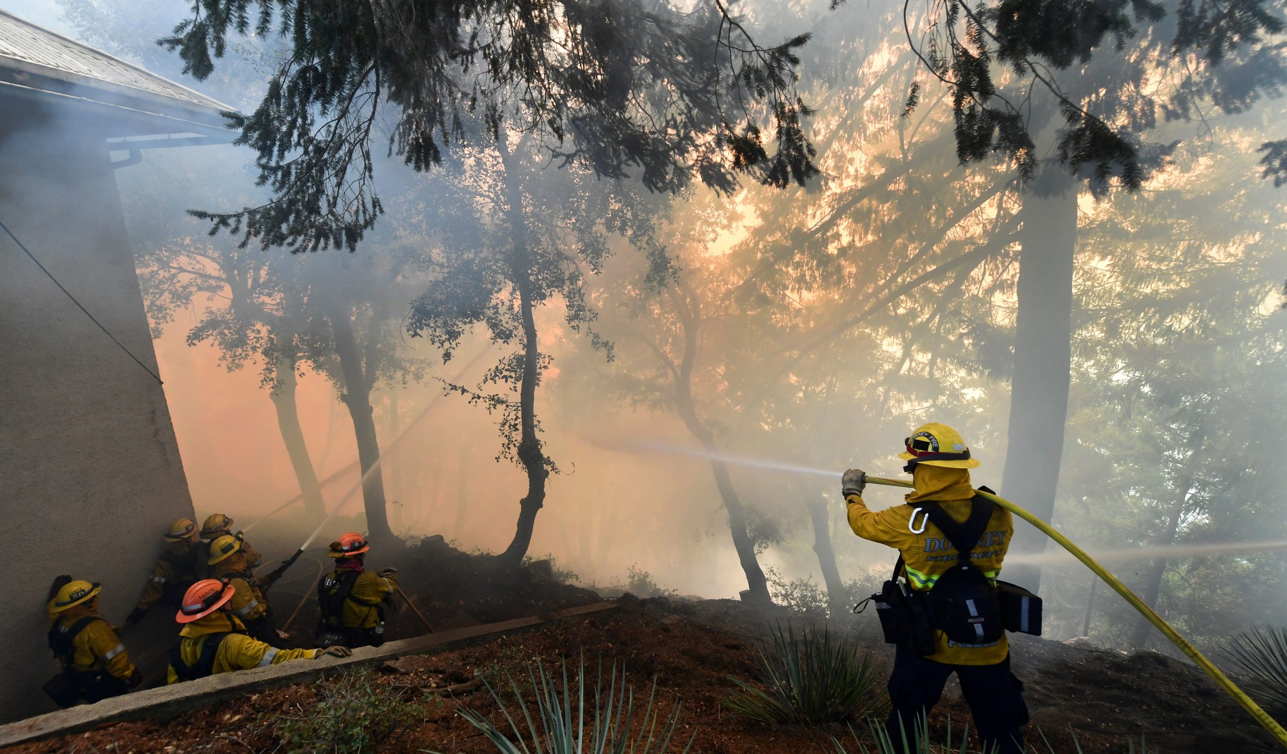 Firefighters work to protect a building at Mt. Wilson Observatory as the Bobcat Fire burns in the Angeles National Forest, northeast of Los Angeles, California on September 17, 2020. - The Bobcat Fire erupted on September 6 near the Cogswell Dam and West Fork Day Use area northeast of Mount Wilson within the Angeles National Forest, expanding from 46,263 acres to 50,539 acres since September 16 while remaining only 3% contained. (Photo by Frederic J. Brown/AFP via Getty Images)