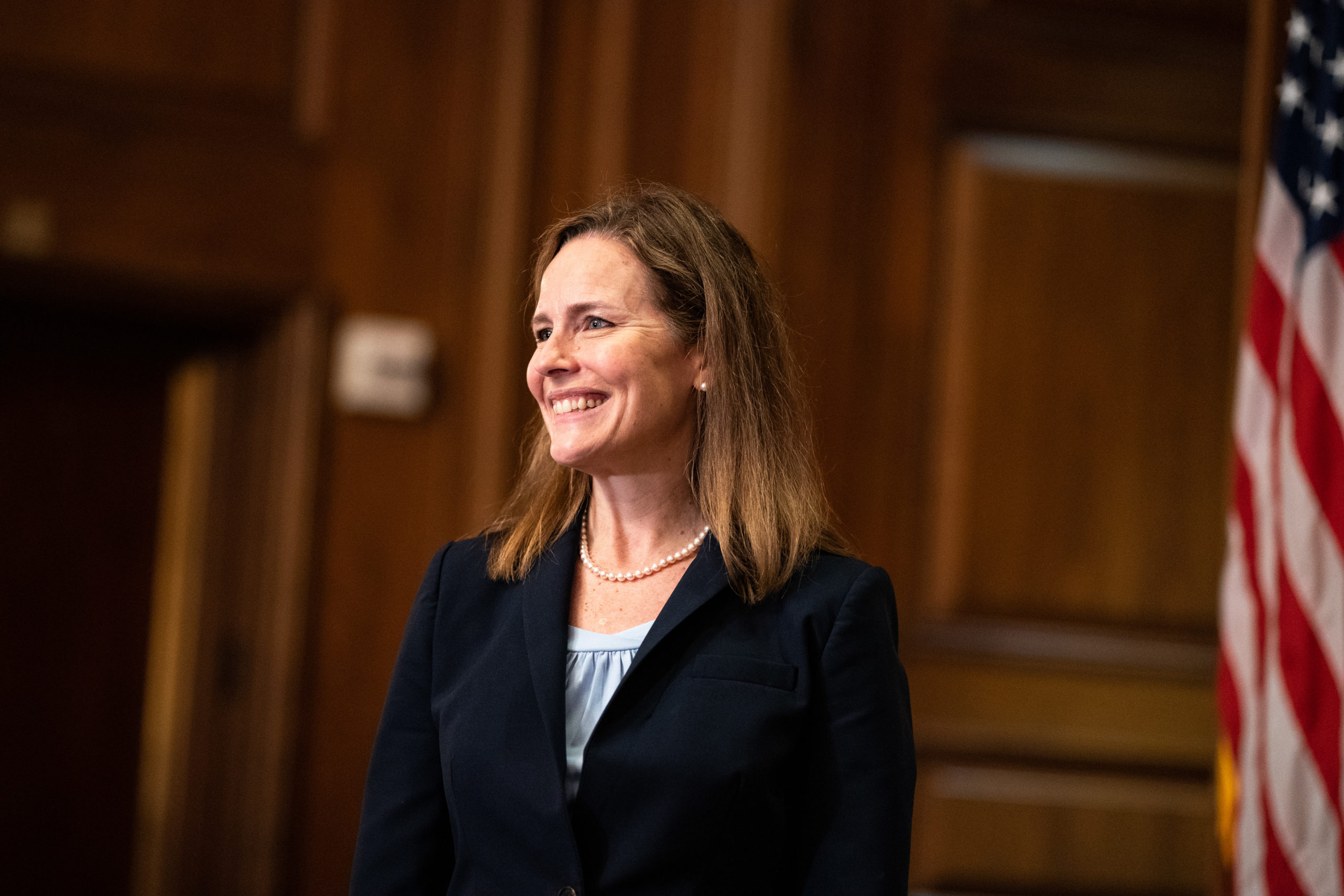 Judge Amy Coney Barrett, President Donald Trumps nominee for Supreme Court, smiles for a photo with Senator David Perdue, R-GA at the US Capitol on September 30, 2020, in Washington, DC. (Photo by Anna Moneymaker / POOL / AFP) (Photo by ANNA MONEYMAKER/POOL/AFP via Getty Images)