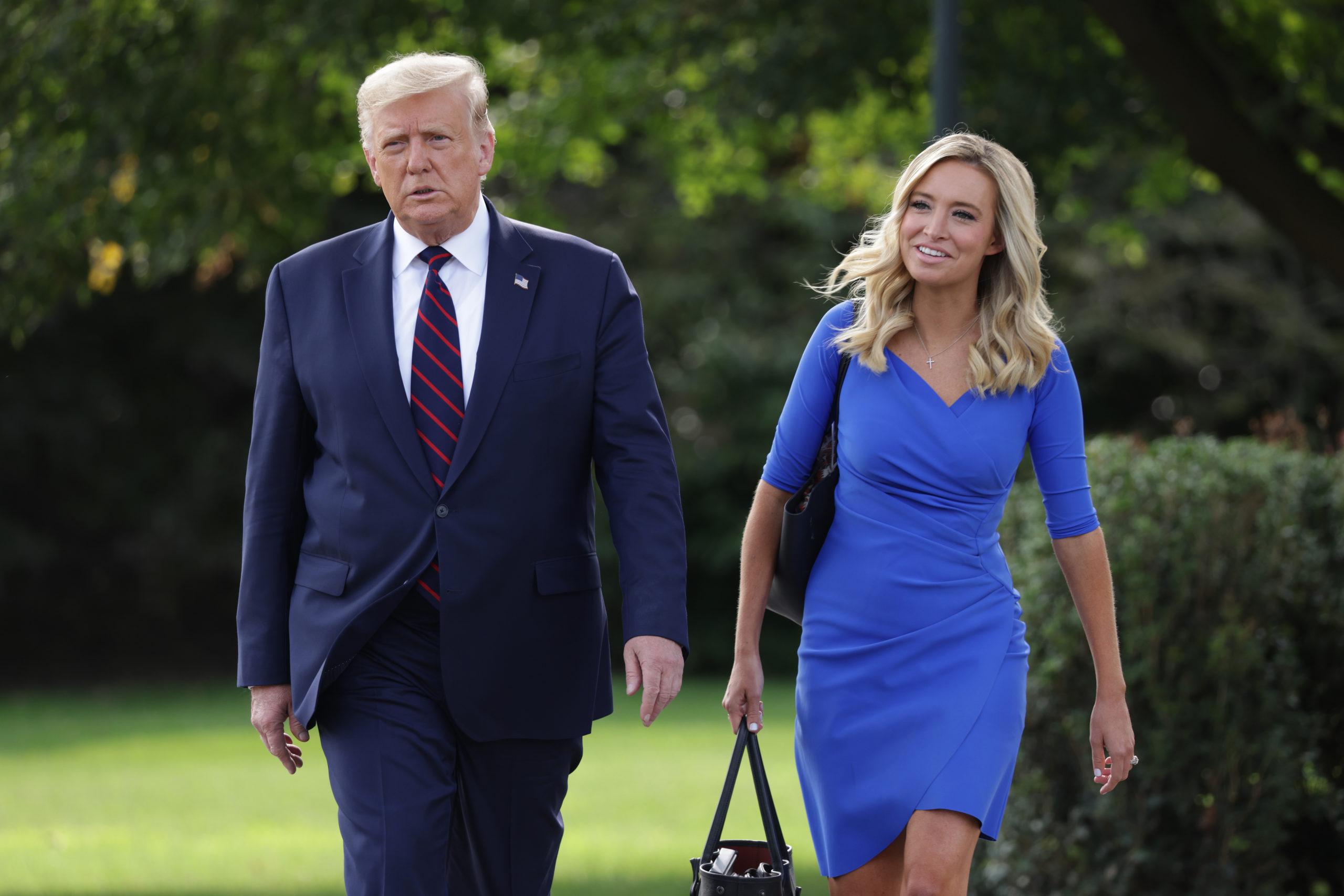 WASHINGTON, DC - SEPTEMBER 15: U.S. President Donald Trump and White House Press Secretary Kayleigh McEnany walk toward members of the press prior to Trump’s departure from the White House on September 15, 2020 in Washington, DC. President Trump was traveling to Philadelphia to participate in an ABC News town hall event. (Photo by Alex Wong/Getty Images)
