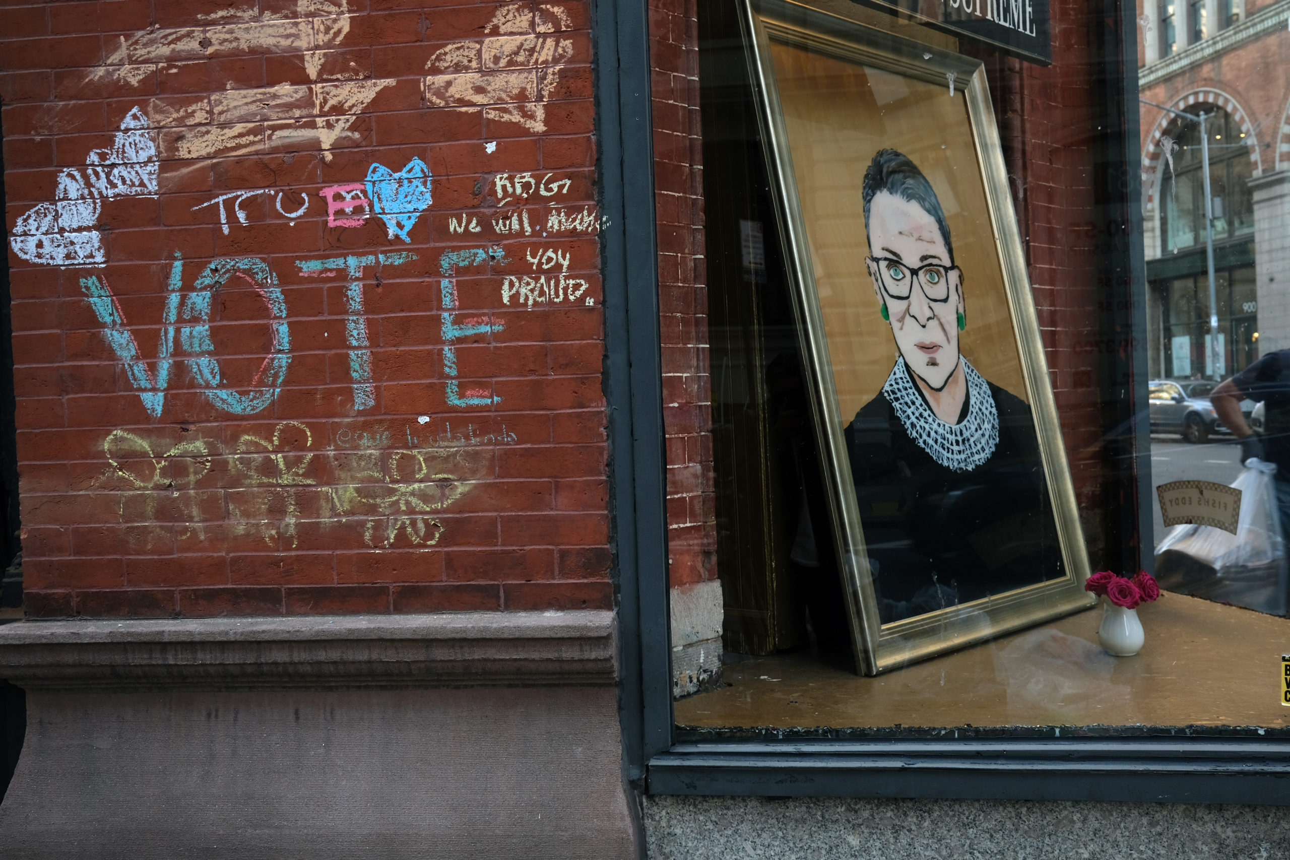 A painting of the late Supreme Court Justice Ruth Bader Ginsburg is displayed in a shop window on September 21, 2020 in New York City. Ginsburg, who in her 80s became a legal, cultural and feminist icon, died at her home in Washington, D.C. after serving on the high court since 1993. (Photo by Spencer Platt/Getty Images)