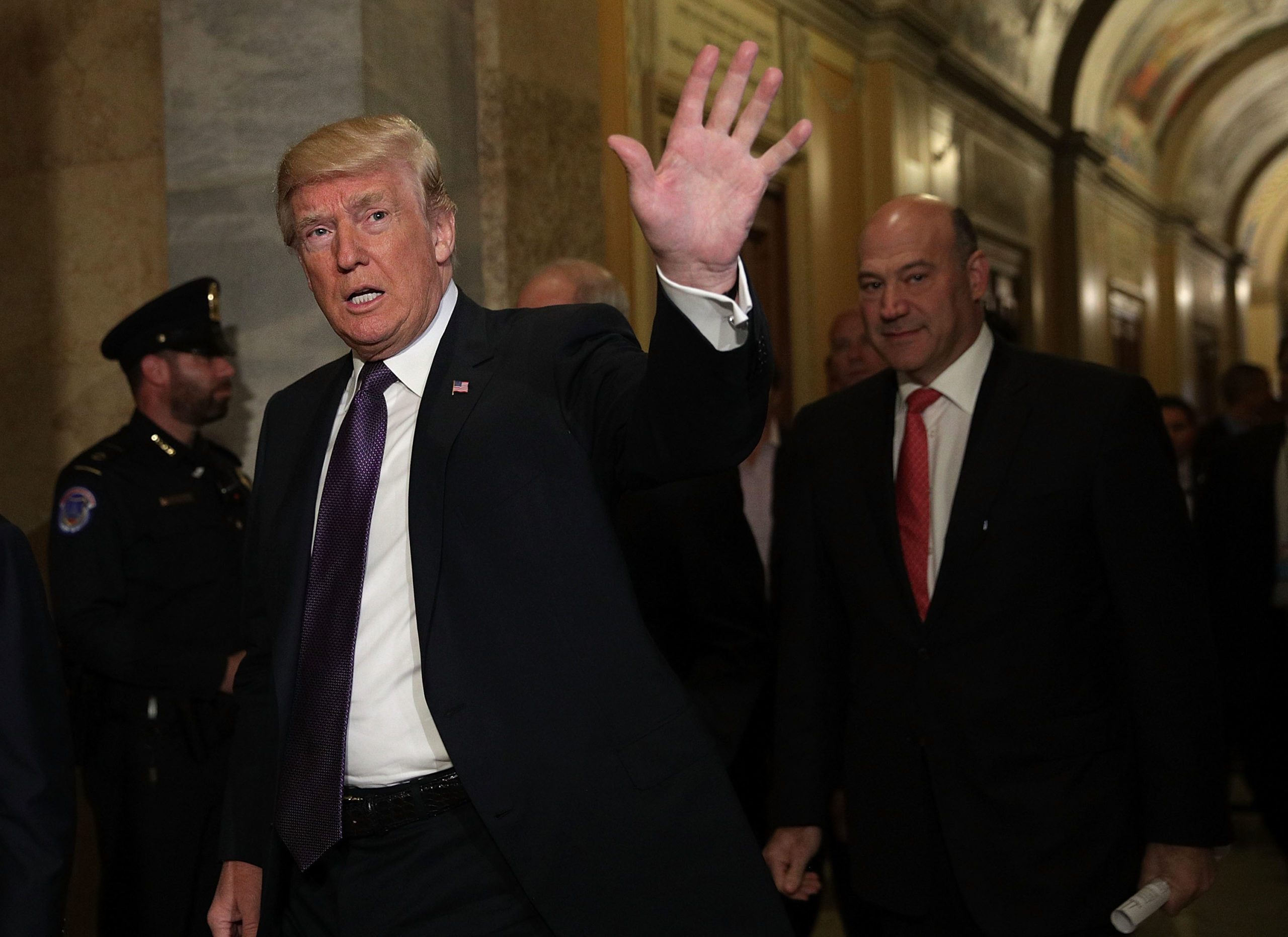 WASHINGTON, DC - NOVEMBER 16: U.S. President Donald Trump (L) waves as he arrives at the Capitol with Director of the National Economic Council Gary Cohn (R) for a House Republican Conference meeting November 16, 2017 in Washington, DC. President Trump travels to Capitol Hill to discuss the tax reform bill as the House prepare to vote on the bill today. (Photo by Alex Wong/Getty Images)