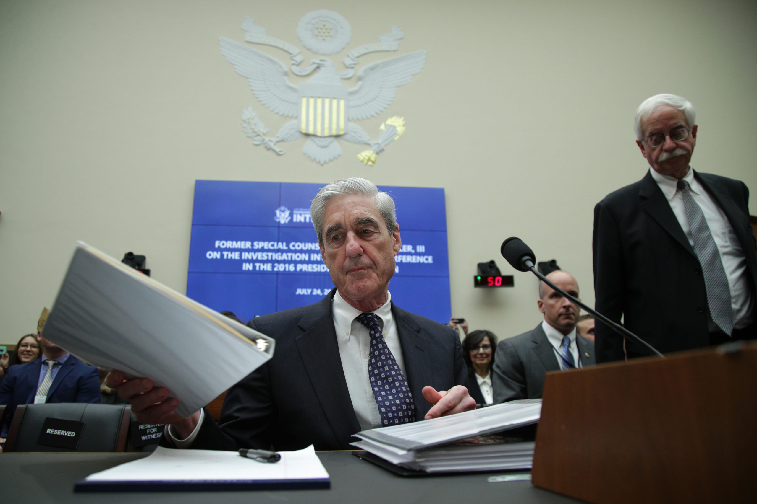 WASHINGTON, DC - JULY 24: Former Special Counsel Robert Mueller waits to testify before the House Intelligence Committee about his report on Russian interference in the 2016 presidential election in the Rayburn House Office Building July 24, 2019 in Washington, DC. Mueller testified earlier in the day before the House Judiciary Committee in back-to-back hearings on Capitol Hill. (Photo by Alex Wong/Getty Images)