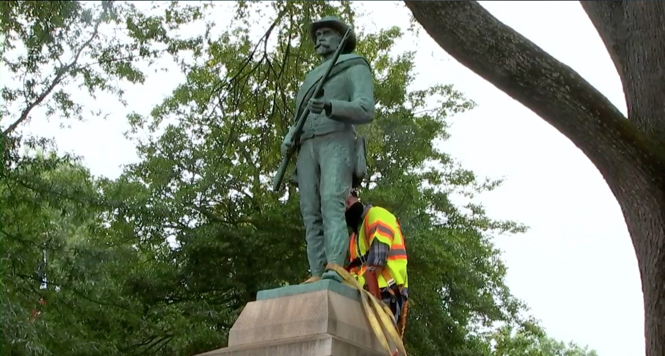 A Charlottesville, Virginia city worker removes the "At Ready" Confederate statue in front of the county court house Saturday. (Abemarle County/Video Screenshot/Facebook)