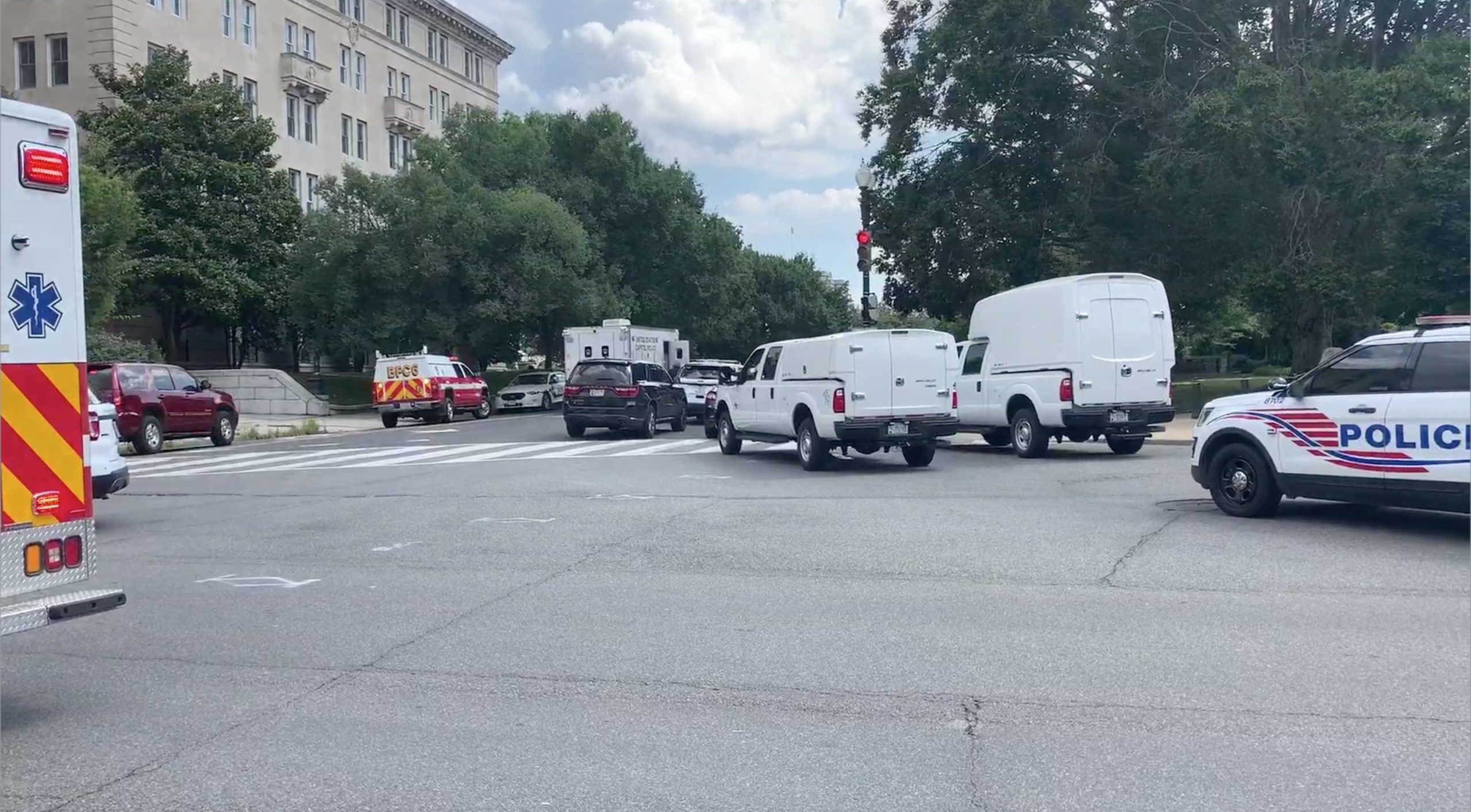 Emergency vehicles respond to the arson of three police cars in front of the U.S. Supreme Court in July. (WUSA/Video screenshot)