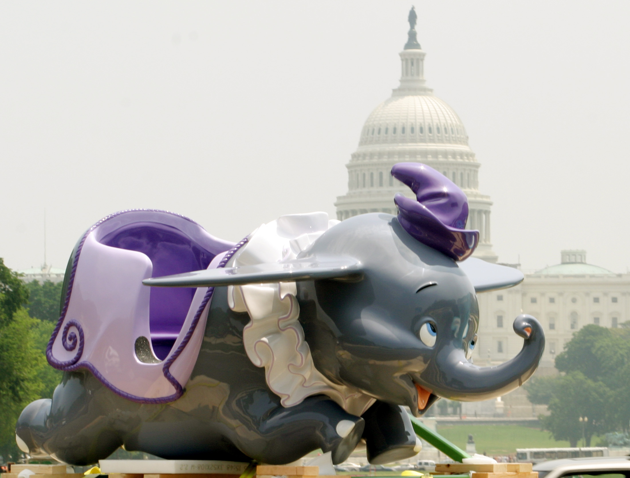 A Disneyland ride from their 1955 opening year, Dumbo from "Dumbo the Flying Elephant", is paraded around the National Mall in Washington D.C. with the U.S. Capitol in the background, June 6, 2005. Walt Disney CEO Michael Eisner will present two ride vehicles, including Dumbo, to the National Museum of American History on June 9 as Disneyland gets ready to celebrate its 50th anniversary on July 17. REUTERS/Molly Riley MR/CN