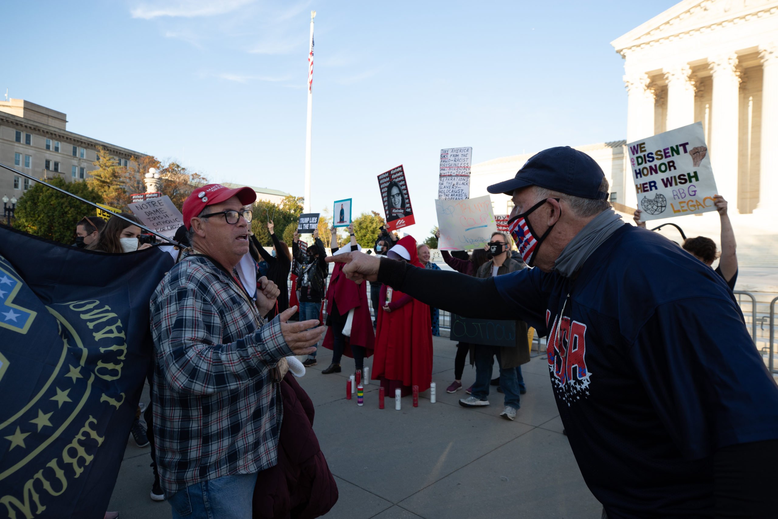A Biden supporter yells at a Trump supporter for questioning him before he walks off and gives a Nazi salute in Washington, D.C. on October 26, 2020. (Kaylee Greenlee - Daily Caller News Foundation)