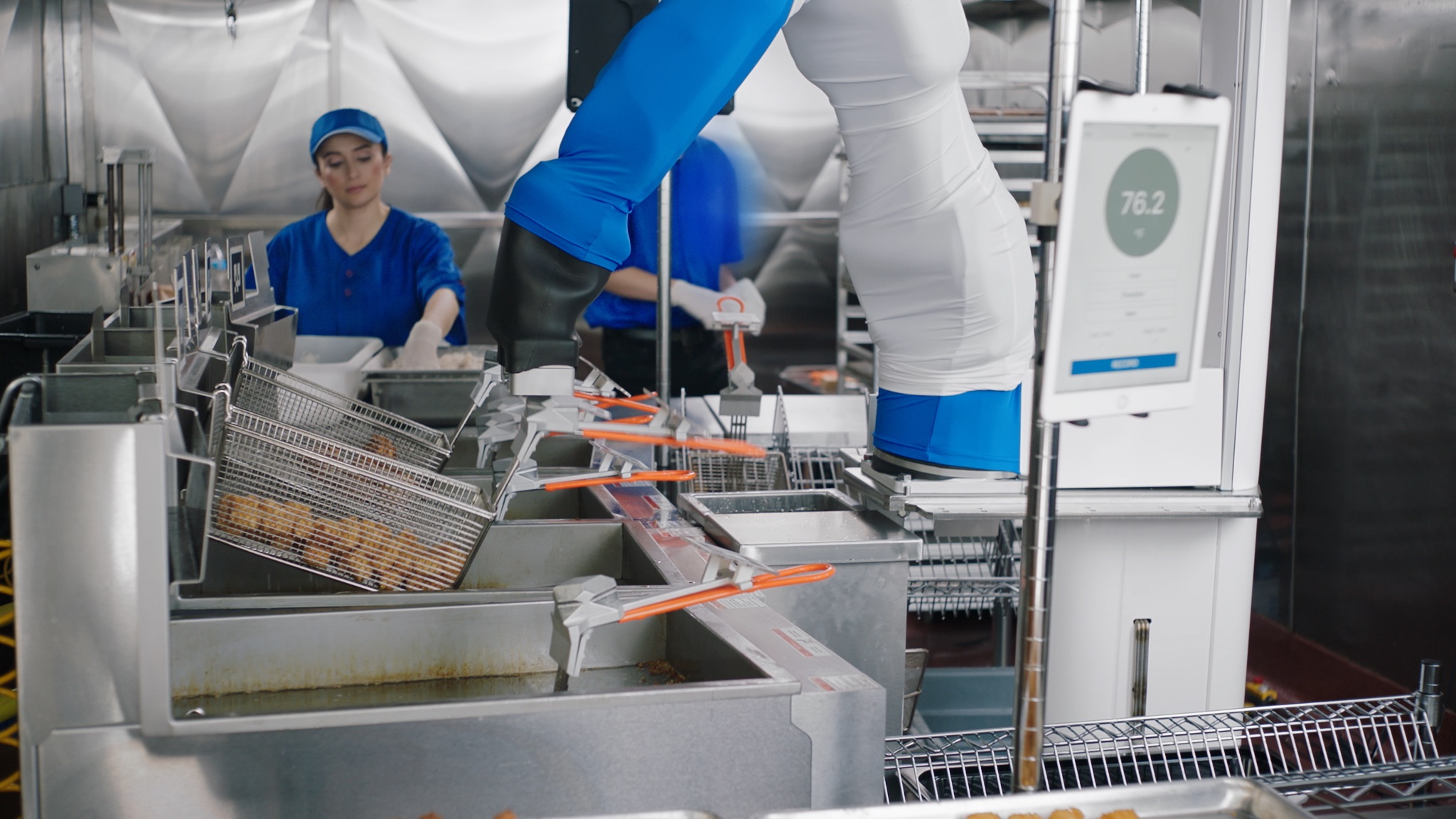 Flippy, a robotic fry cook, is pictured operating in a kitchen. (Miso Robotics)