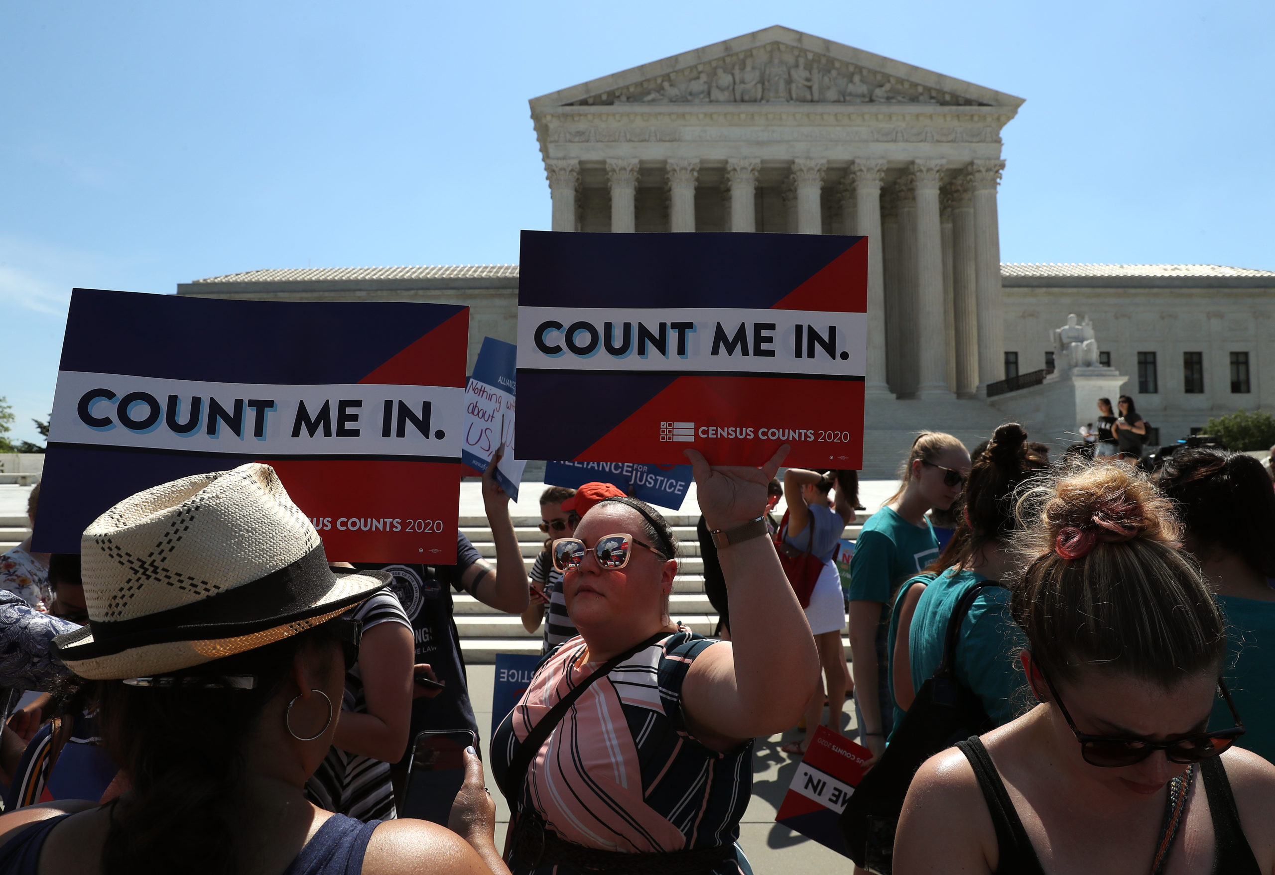 WASHINGTON, DC - JUNE 27: People gather in in front of the U.S. Supreme Court as decisions are handed down on June 27, 2019 in Washington, DC. The high court blocked a citizenship question from being added to the 2020 census for now, and in another decision ruled that the Constitution does not bar partisan gerrymandering. (Photo by Mark Wilson/Getty Images)