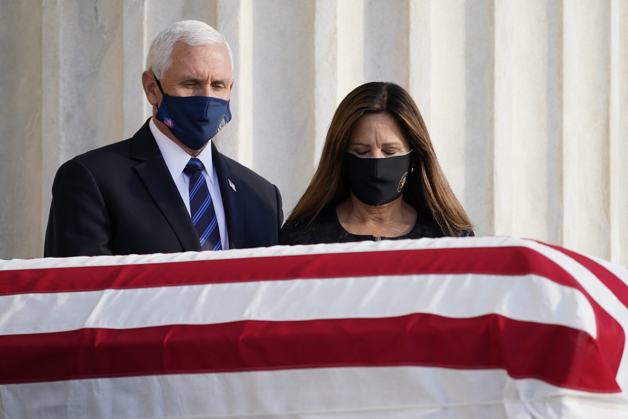 WASHINGTON, DC - SEPTEMBER 23: U.S. Vice President Mike Pence and his wife Karen Pence pay their respects at the casket bearing the remains of Justice Ruth Bader Ginsburg at the steps of the U.S. Supreme Court on September 23, 2020 in Washington, DC. Ginsburg, appointed to the high court by President Bill Clinton in 1993, died September 18 of complications due to pancreatic cancer. She was 87. (Photo by Alex Brandon-Pool/Getty Images)