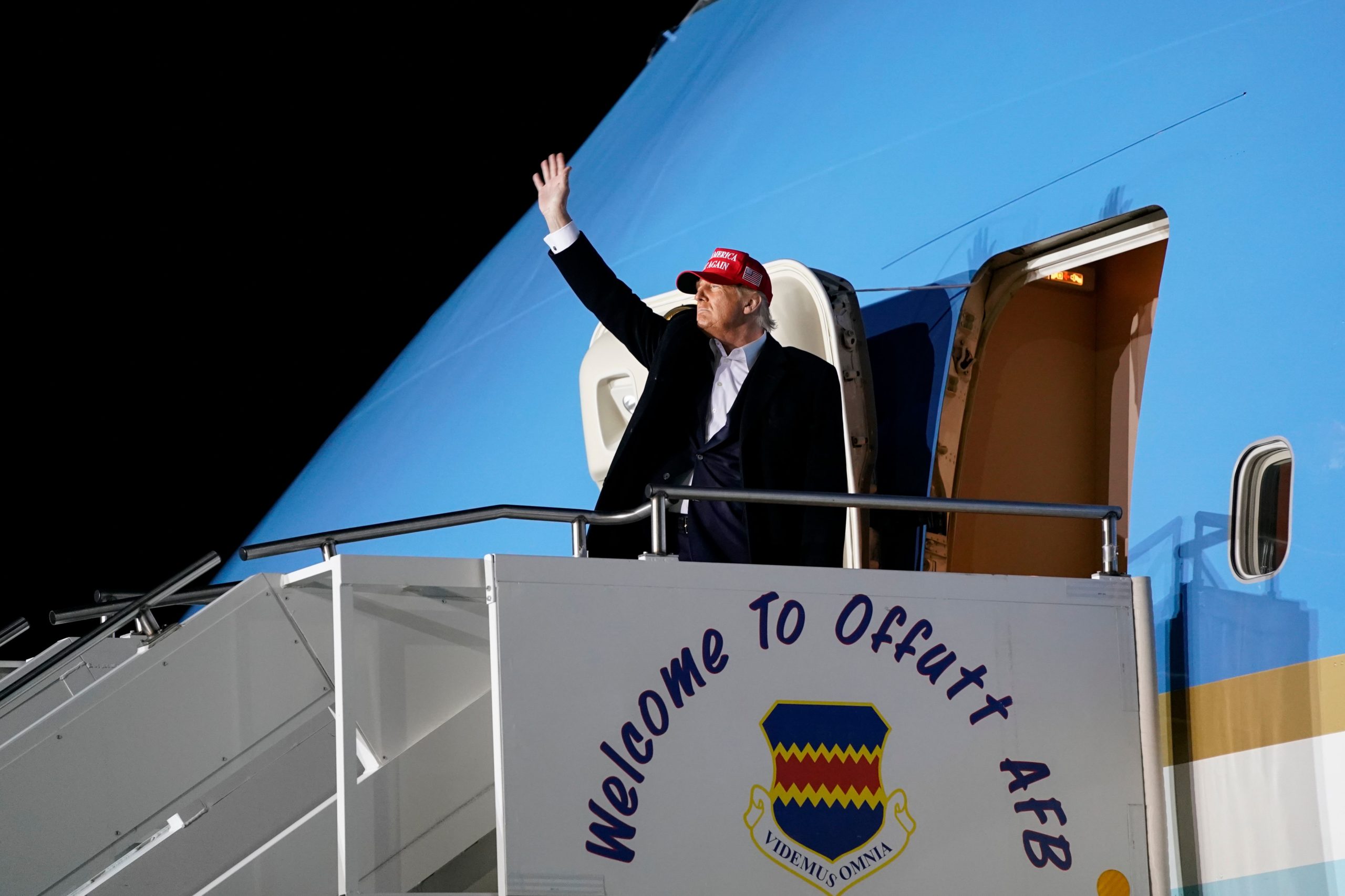 U.S. President Donald Trump waves as he boards Air Force One after addressing supporters at a Make America Great Again campaign event at Des Moines International Airport in Iowa on Oct. (Alex Edelman/AFP via Getty Images)