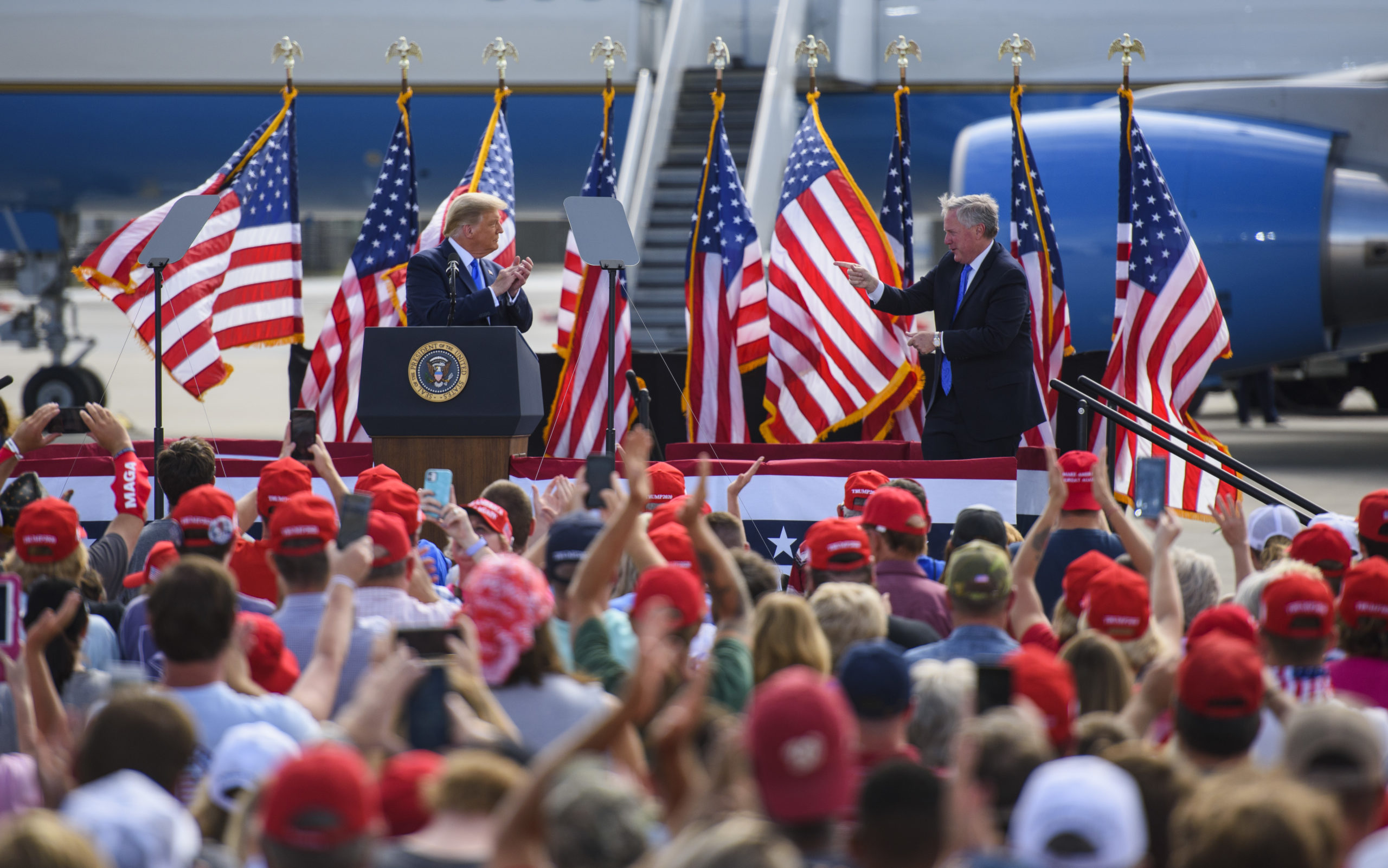 GREENVILLE, NC - OCTOBER 15: President Donald Trump and White House Chief of Staff Mark Meadows appear on stage during a Make America Great Again rally at the Pitt-Greenville Airport on October 15, 2020 in Greenville, North Carolina. Thousands of people gathered to listen to the President 19 days before the 2020 presidential election. (Photo by Melissa Sue Gerrits/Getty Images)