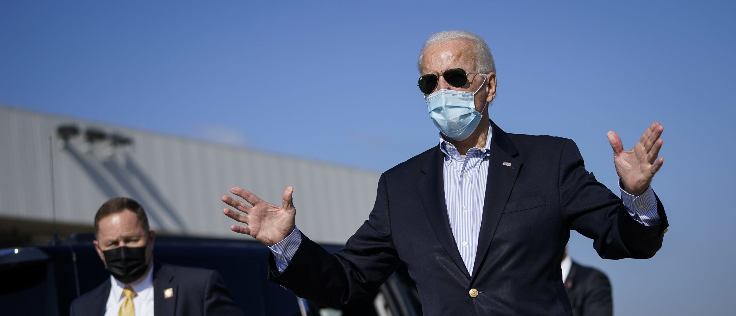 Democratic presidential nominee Joe Biden speaks to reporters before boarding his campaign plane at New Castle Airport on October 22, 2020 in New Castle, Delaware. (Drew Angerer/Getty Images)