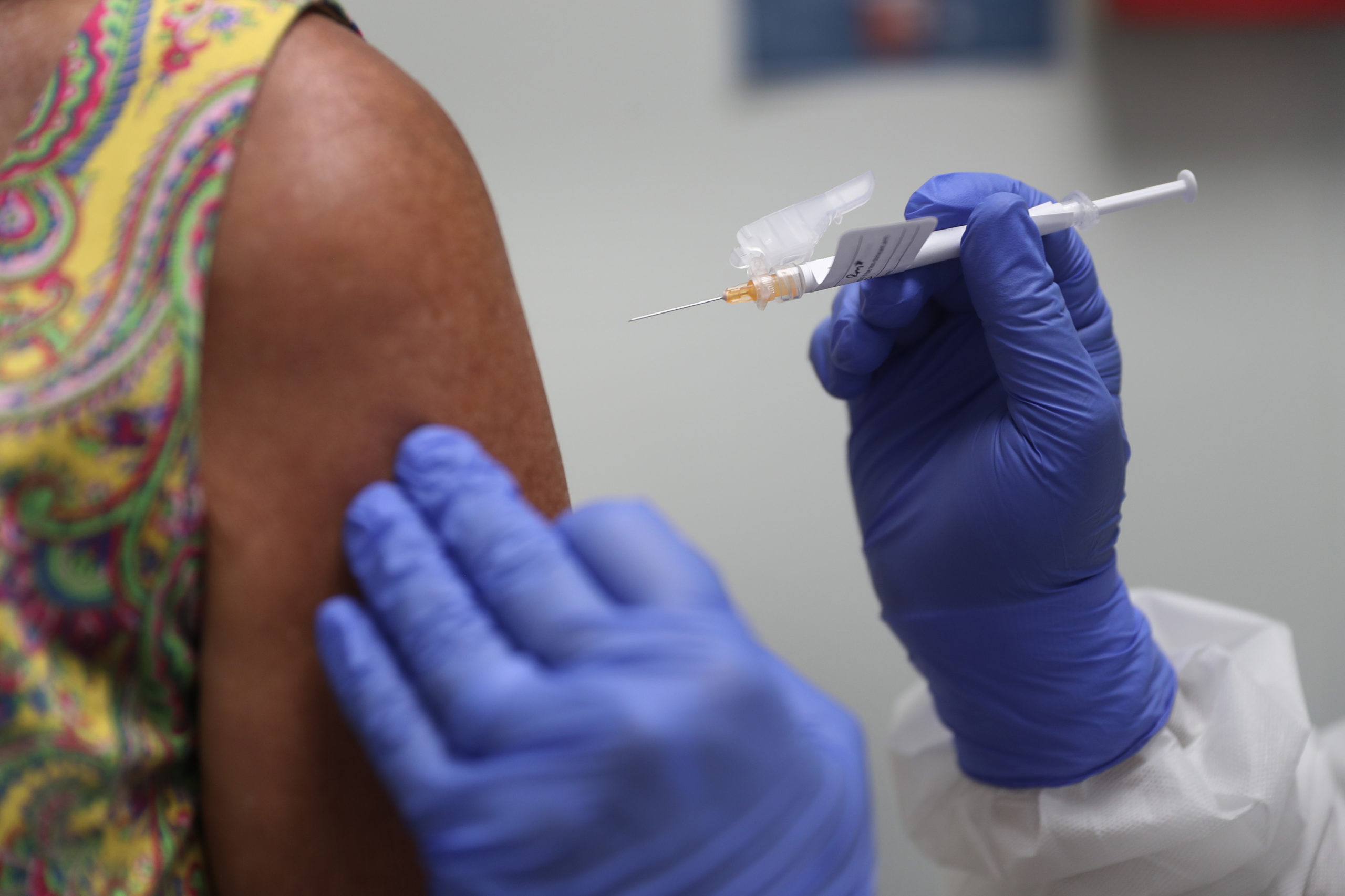 A volunteer receives a coronavirus vaccination at Research Centers of America on Aug. 7 in Florida. (Joe Raedle/Getty Images)