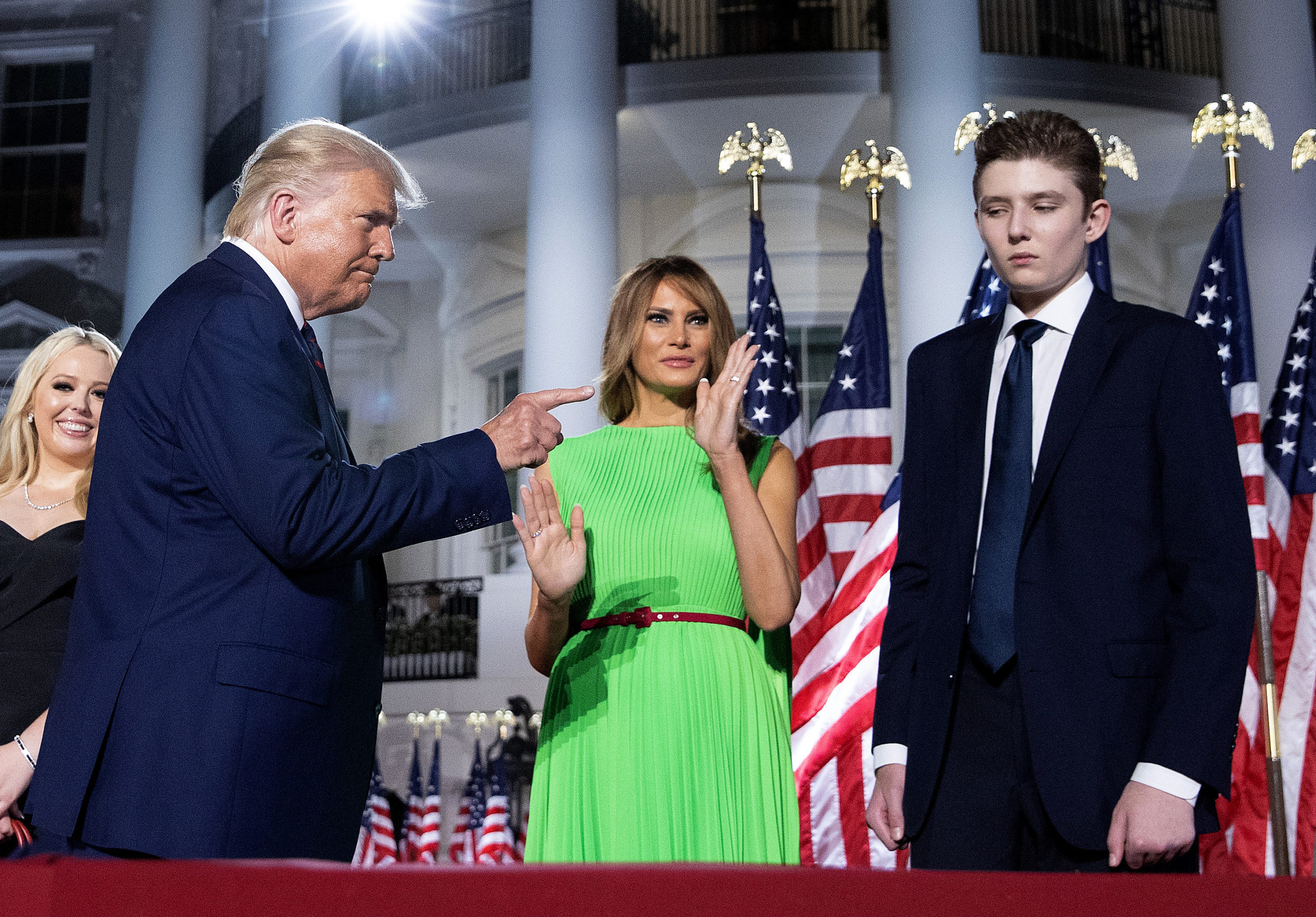 WASHINGTON, DC - AUGUST 27: U.S. President Donald Trump (L) gestures toward first lady Melania Trump and his son Barron Trump after delivering his acceptance speech for the Republican presidential nomination on the South Lawn of the White House August 27, 2020 in Washington, DC. Trump gave the speech in front of 1500 invited guests. (Photo by Chip Somodevilla/Getty Images)