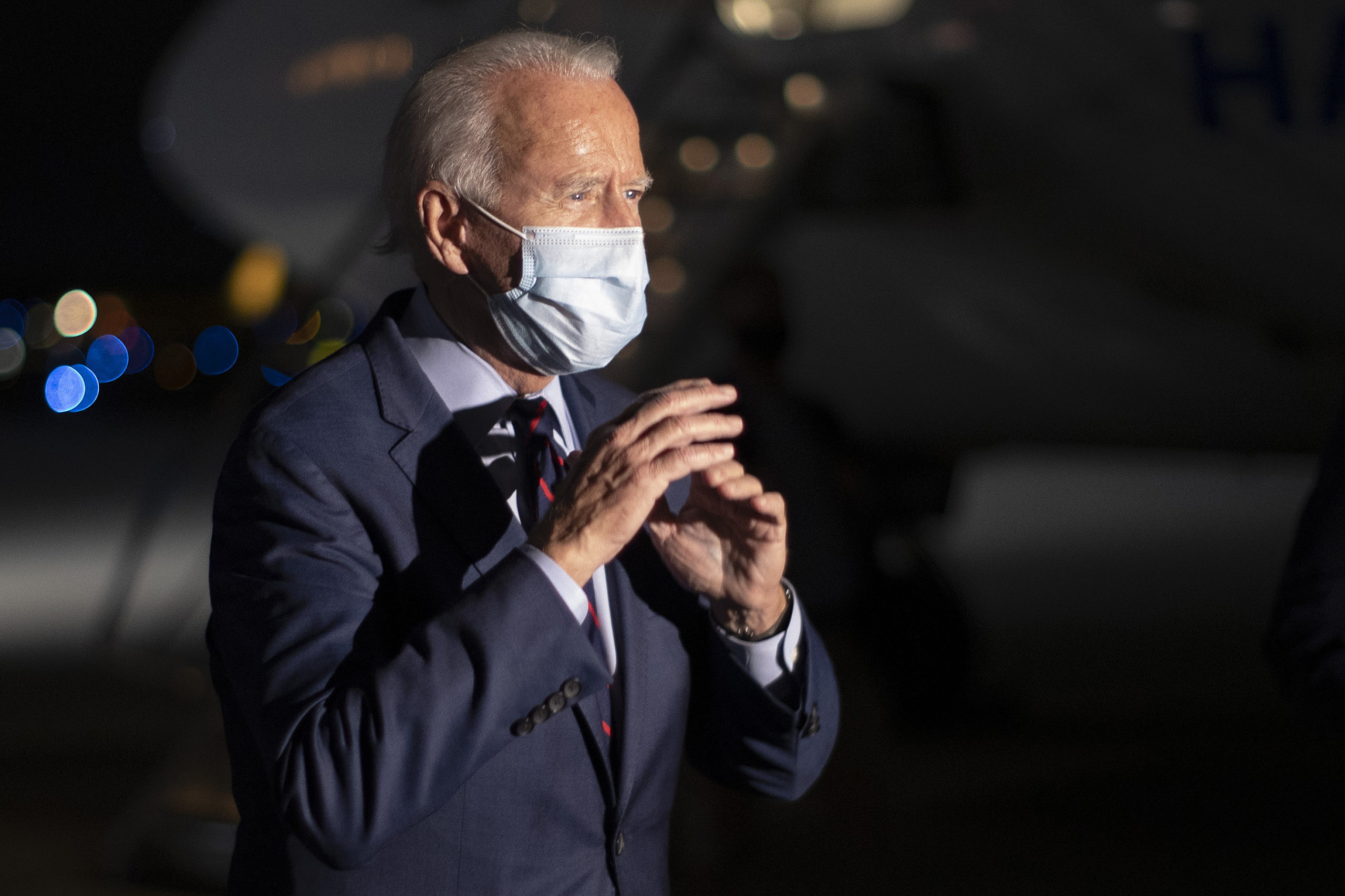 HEBRON, KY - OCTOBER 12: Wearing a face mask to reduce the risk posed by the coronavirus, Democratic presidential nominee Joe Biden talks to reporters before departing Cincinnati/Northern Kentucky International Airport October 12, 2020 in Hebron, Kentucky. With 21 days until the election, Biden campaigned in Toledo and Cincinnati. (Photo by Chip Somodevilla/Getty Images)