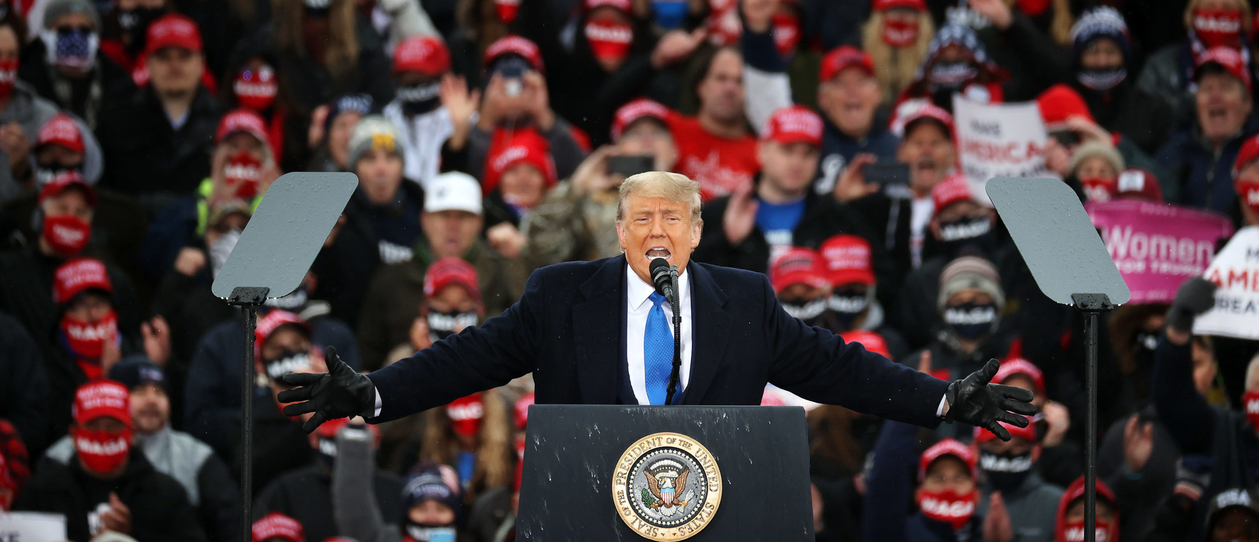 LANSING, MICHIGAN - OCTOBER 27: U.S. President Donald Trump addresses supporters during a campaign rally at Capital Region International Airport October 27, 2020 in Lansing, Michigan. With one week until Election Day, Trump is campaigning in Michigan, a state he won in 2016 by less than 11,000 votes, the narrowest margin of victory in the state's presidential election history. (Photo by Chip Somodevilla/Getty Images)