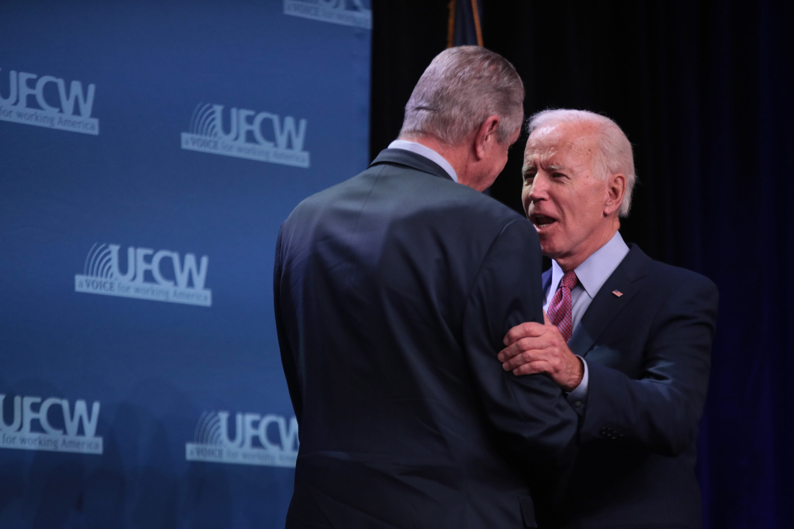 UFCW president Marc Perrone greets former Vice President Joe Biden at the union's 2020 presidential candidate forum in Altoona, Iowa. (Scott Olson/Getty Images)