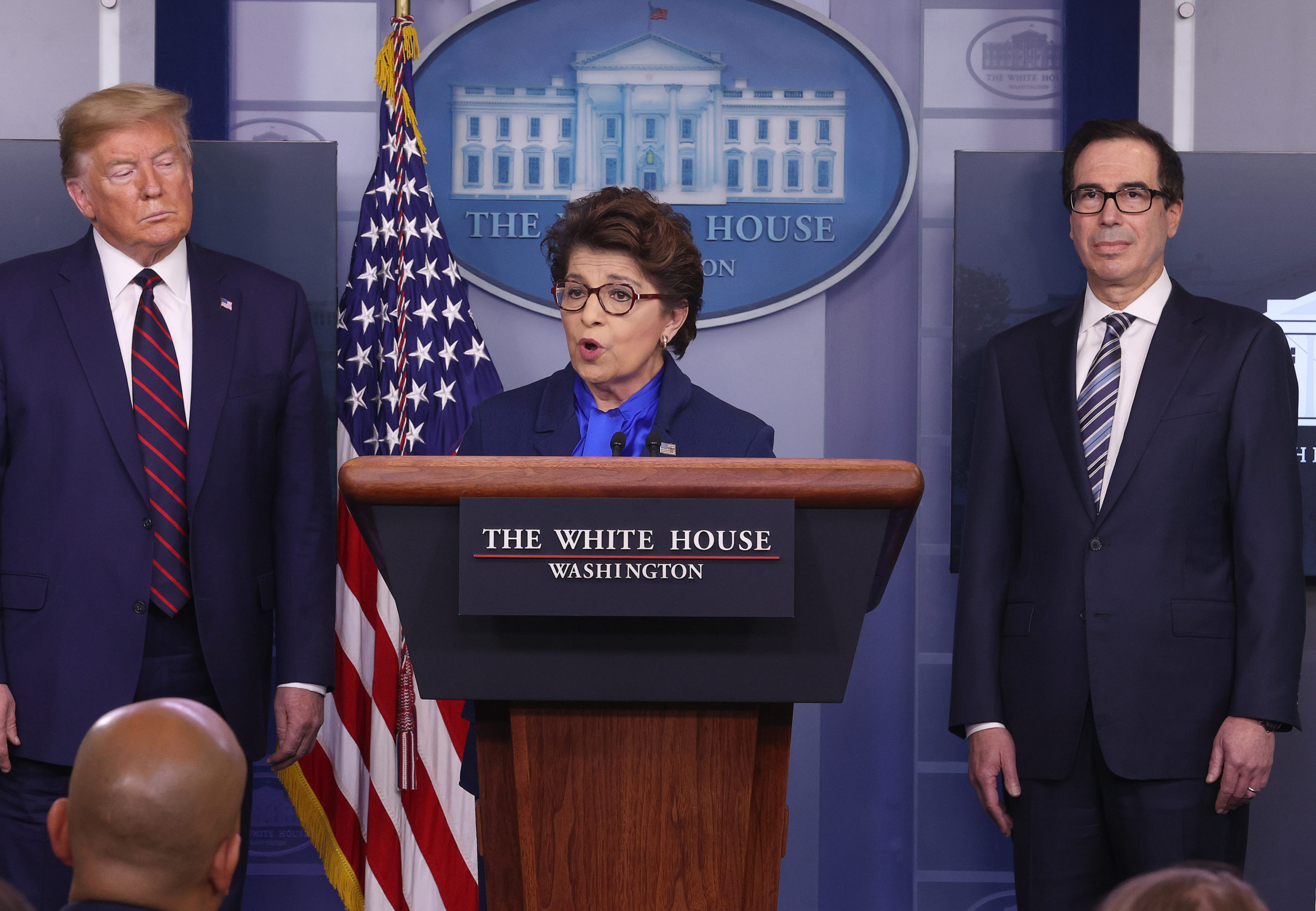 WASHINGTON, DC - APRIL 02: Small Business Administrator, Jovita Carranza speaks while flanked by U.S. President Donald Trump and Secretary of Treasury Steve Mnuchin (R) in the press briefing room with members of the White House Coronavirus Task Force April 2, 2020 in Washington, DC. The U.S. government reported an unprecedented 6.6 million jobless claims this morning as a result of the coronavirus outbreak. (Photo by Win McNamee/Getty Images)