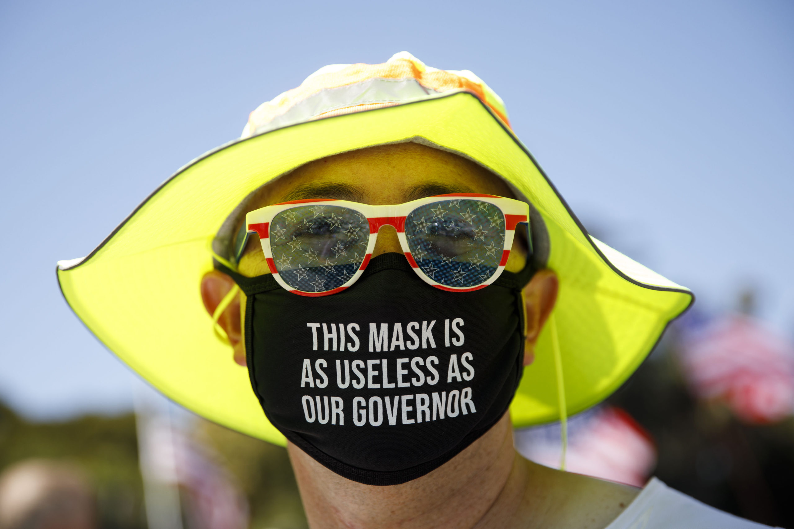 A demonstrator wears a facemask referring to the governor of California during a WalkAway rally in support of the US president on August 8, 2020 in Beverly Hills, California. (Photo by Patrick T. Fallon / AFP) (Photo by PATRICK T. FALLON/AFP via Getty Images)