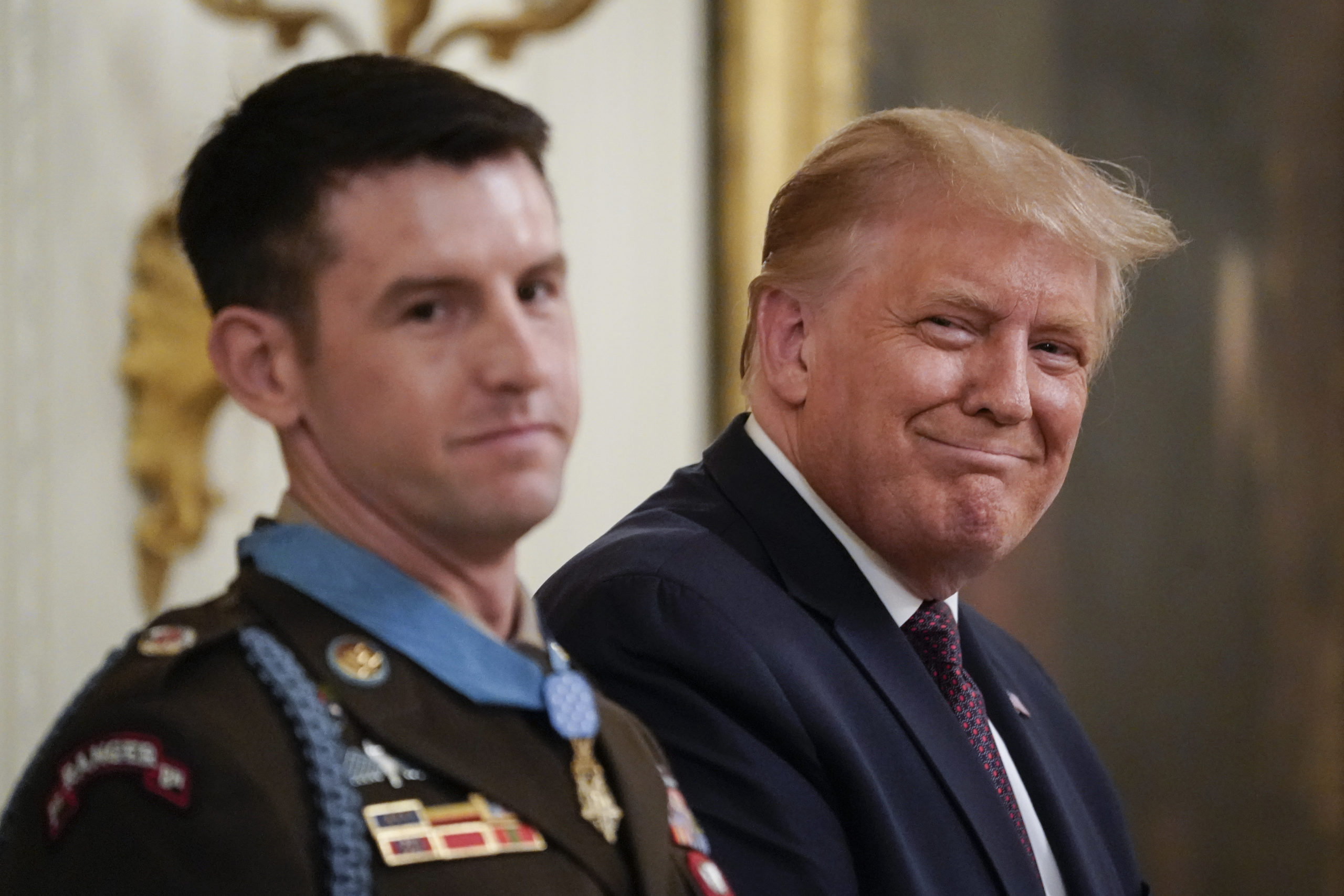 WASHINGTON, DC - SEPTEMBER 11: U.S. President Donald Trump presents the Medal of Honor to Sergeant Major Thomas P. Payne, United States Army, for conspicuous gallantry in the East Room of the White House on September 11, 2020 in Washington, DC. On October 22, 2015, during a daring nighttime hostage rescue in Kirkuk Province, Iraq, then-Sergeant First Class Payne led a combined assault team charged with clearing one of two buildings known to house hostages. His actions were key to liberating 75 hostages during a rescue mission that resulted in 20 enemy fighters killed in action. (Photo by Drew Angerer/Getty Images)