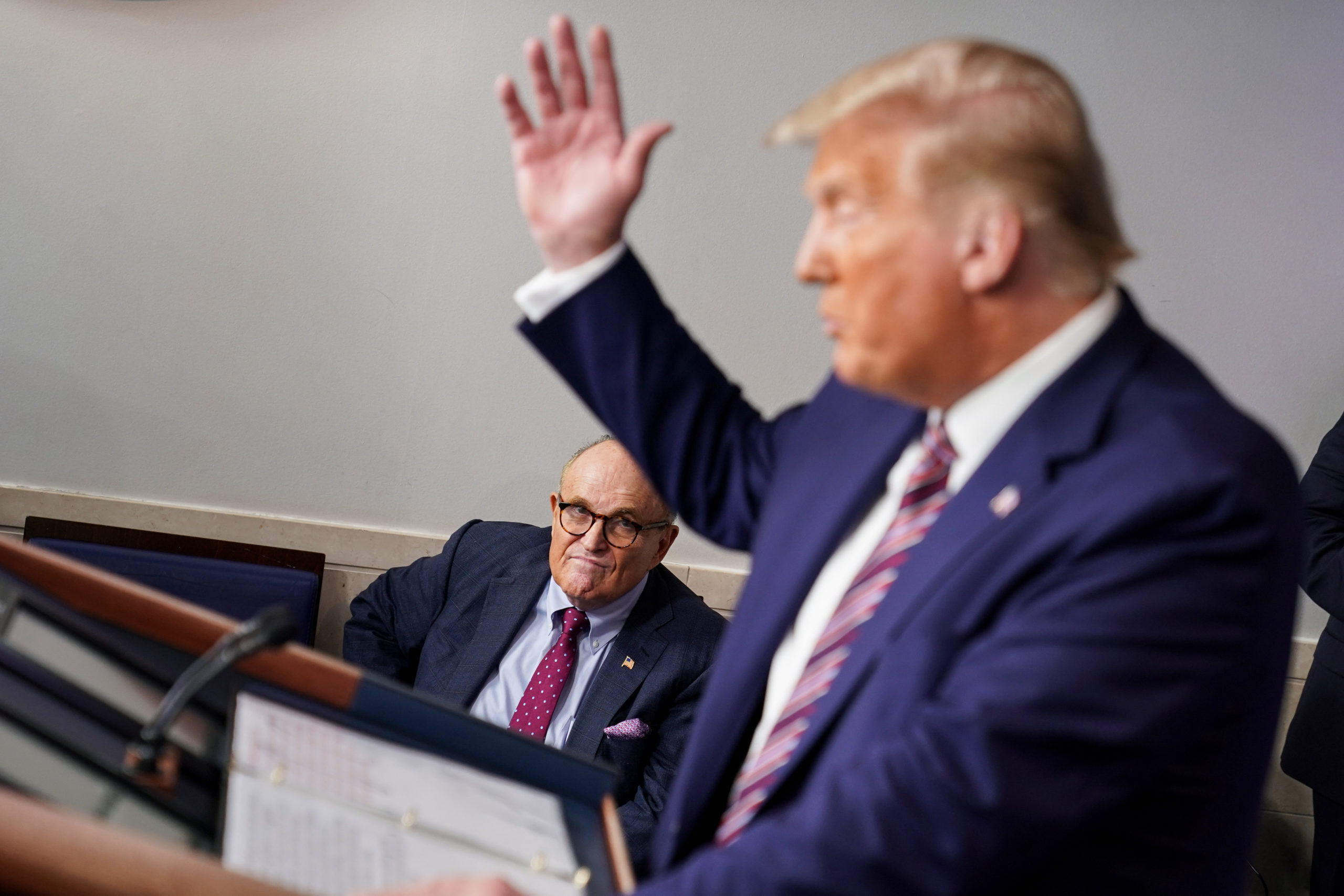 WASHINGTON, DC - SEPTEMBER 27: Former New York Mayor Rudy Giuliani listens as U.S. President Donald Trump speaks during a news conference in the Briefing Room of the White House on September 27, 2020 in Washington, DC. Trump is preparing for the first presidential debate with former Vice President and Democratic Nominee Joe Biden on September 29th in Cleveland, Ohio. (Photo by Joshua Roberts/Getty Images)