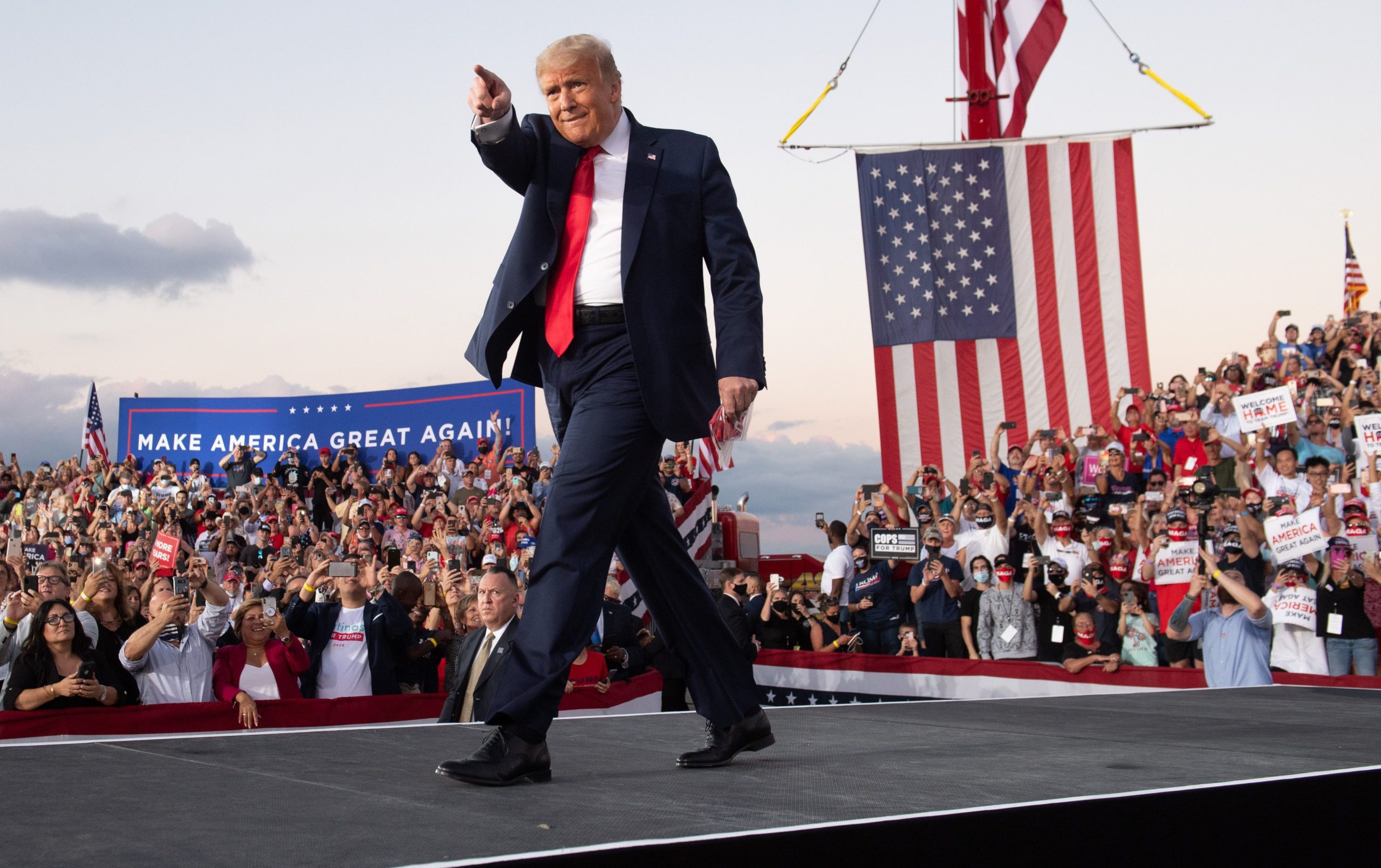 TOPSHOT - US President Donald Trump holds a Make America Great Again rally as he campaigns at Orlando Sanford International Airport in Sanford, Florida, October 12, 2020. (Photo by SAUL LOEB / AFP) (Photo by SAUL LOEB/AFP via Getty Images)