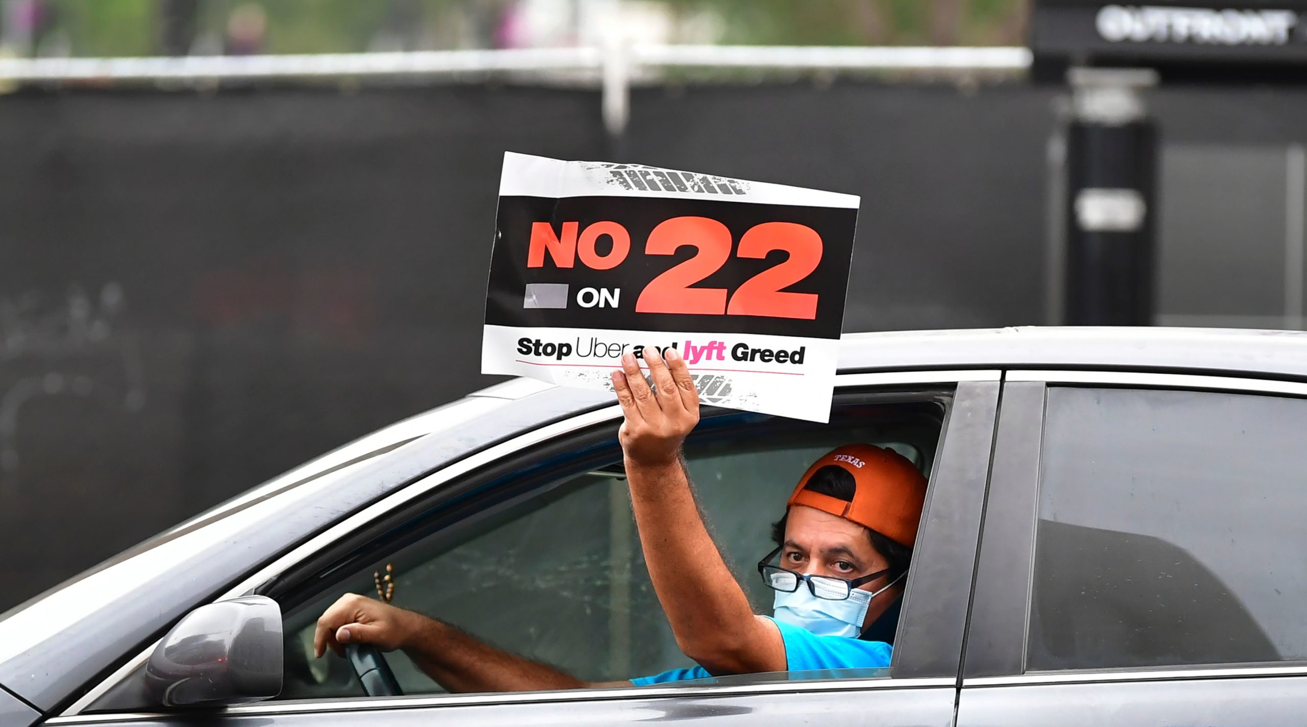 App-based drivers from Uber and Lyft protest in a caravan in front of City Hall in Los Angeles on Oct. 22. (Frederic J. Brown/AFP via Getty Images)