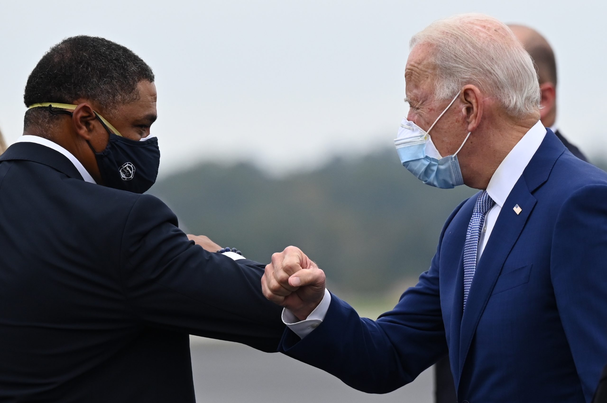 Democratic presidential candidate Joe Biden is greeted by US Congressman Cedric Richmond, D-LA as he arrives in Columbus, Georgia, on October 27, 2020. (Photo by JIM WATSON/AFP via Getty Images)