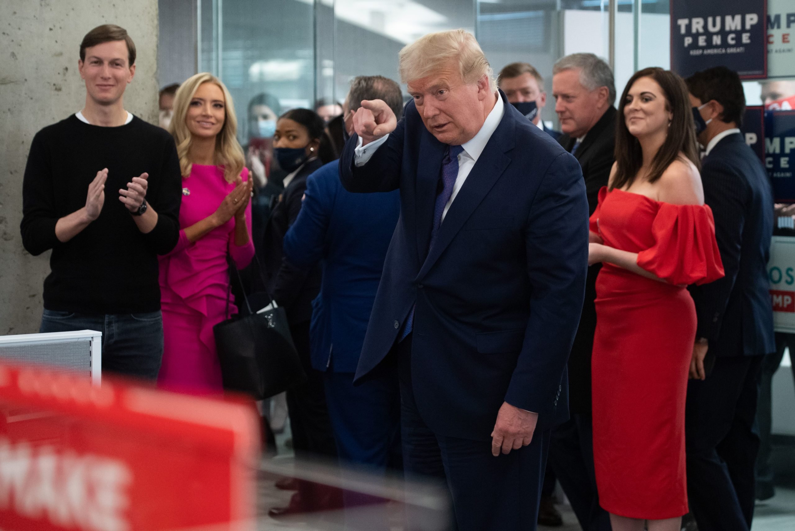 US President Donald Trump points as he visits his campaign headquarters in Arlington, Virginia, November 3, 2020. - A bitterly divided America was going to the polls on Tuesday amid the worst pandemic in a century and an economic crisis to decide whether to give President Donald Trump four more years or send Democrat Joe Biden to the White House. A record-breaking number of early votes -- more than 100 million -- have already been cast in an election that has the nation on edge and is being closely watched in capitals around the world. (Photo by SAUL LOEB/AFP via Getty Images)