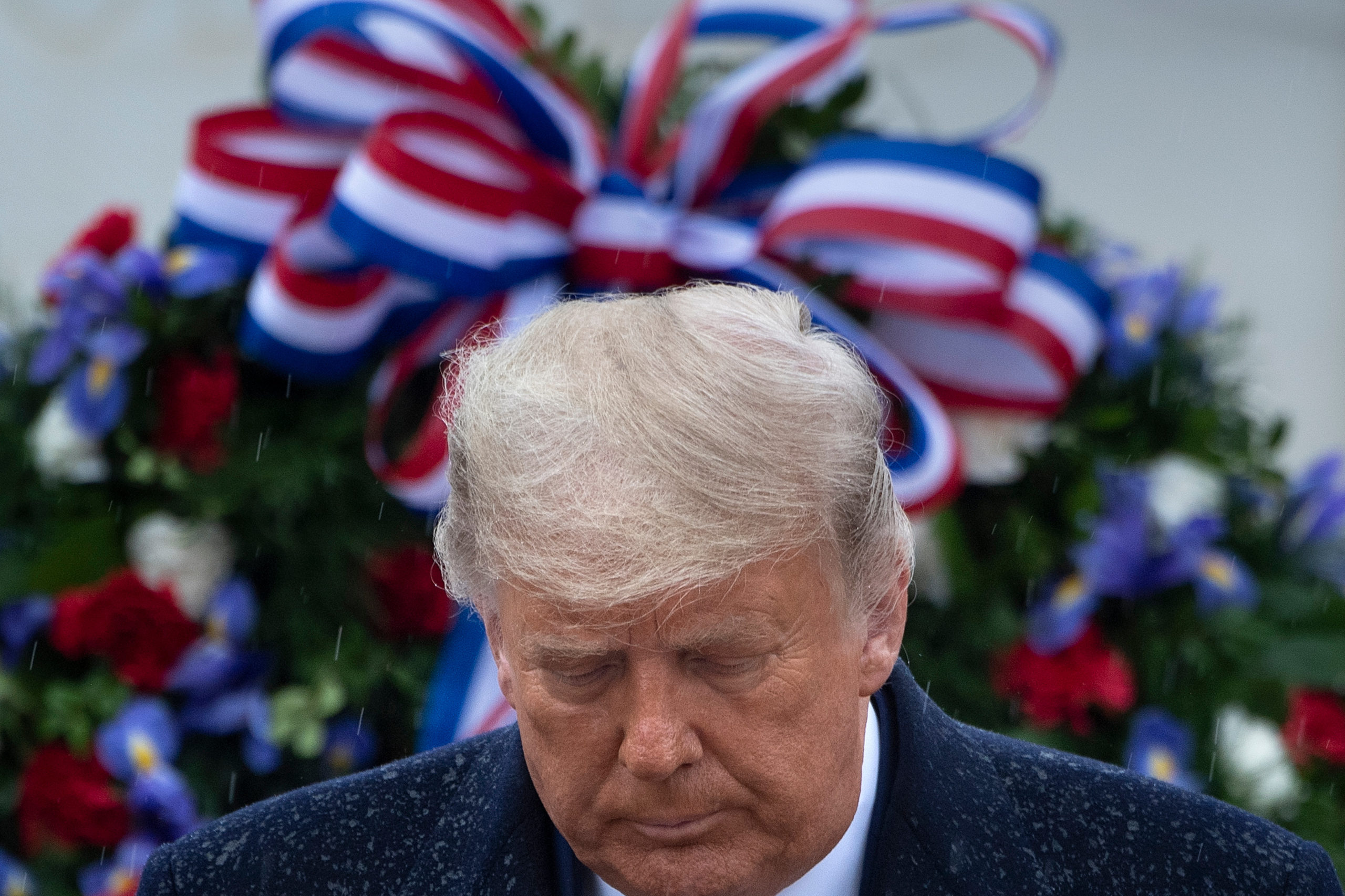 US President Donald Trump leaves after placing a wreath at the Tomb of the Unknown Soldier on Veterans Day at Arlington National Cemetery in Arlington, Virginia, on November 11, 2020. - US President Donald Trump made his first official post-election appearance Wednesday for what should be a moment of national unity to mark Veteran's Day, now marred by his refusal to acknowledge Joe Biden's win. The president visited Arlington National Cemetery, four days after US media projected his Democratic rival would take the White House. (Photo by Brendan Smialowski / AFP) (Photo by BRENDAN SMIALOWSKI/AFP via Getty Images)