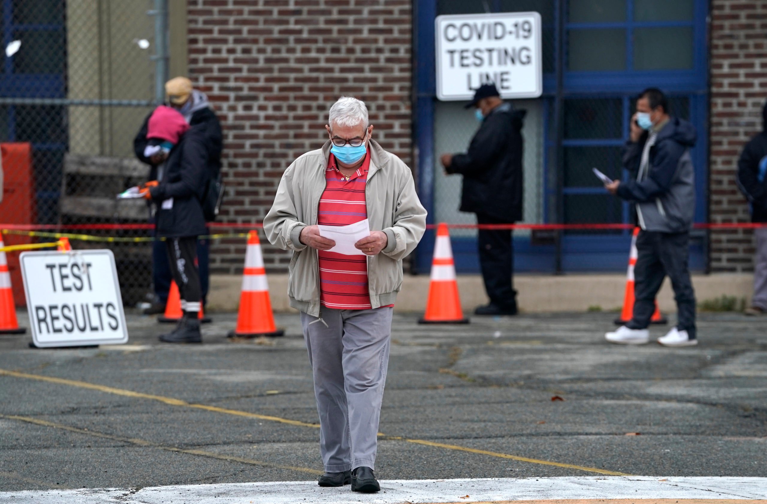 People wait in line to get tested for coronavirus in Newark, New Jersey on Nov. 12. (Timothy Clary/AFP via Getty Images)