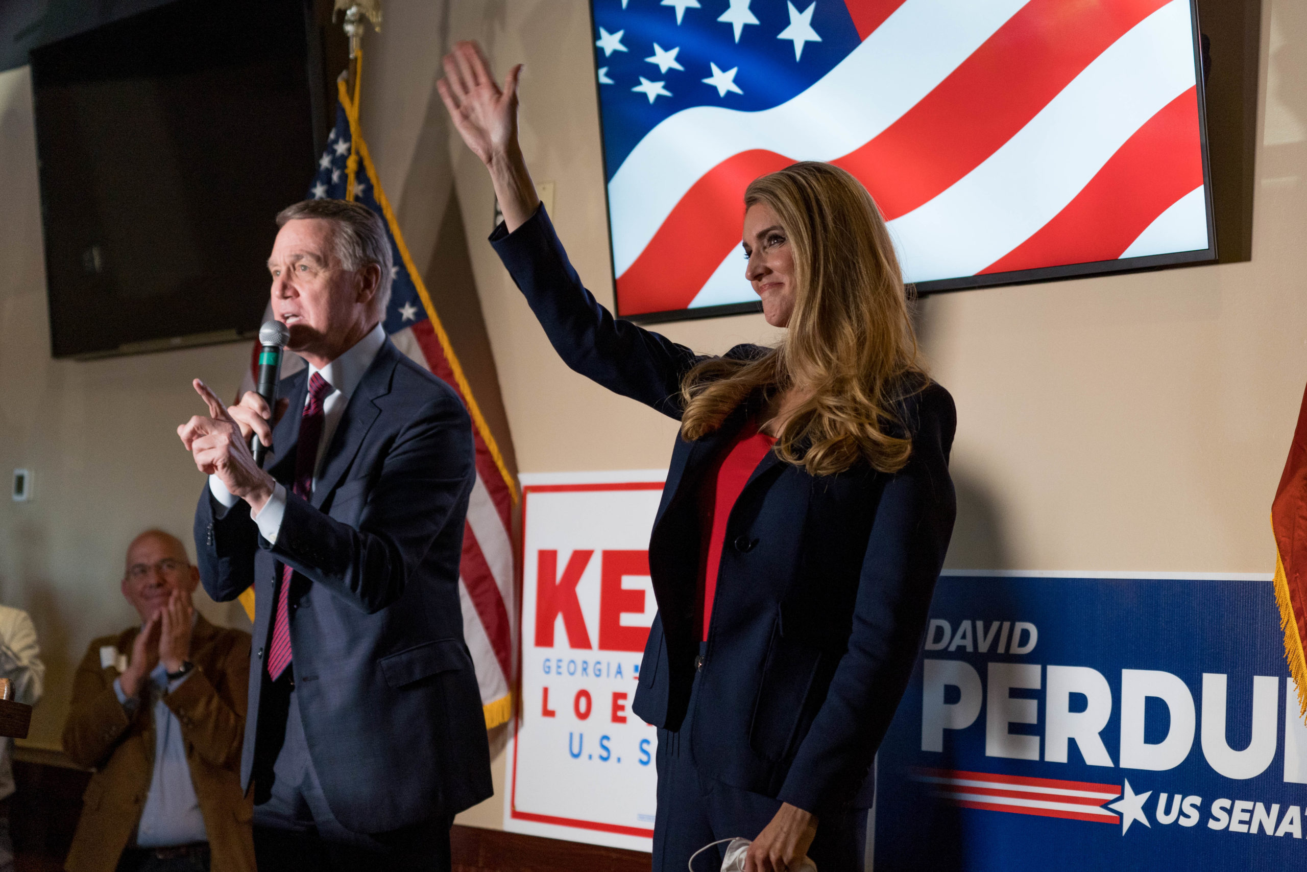 Sens. David Perdue and Kelly Loeffler speak at a campaign event to supporters at a restaurant on Nov. 13 in Cumming, Georgia. (Megan Varner/Getty Images)