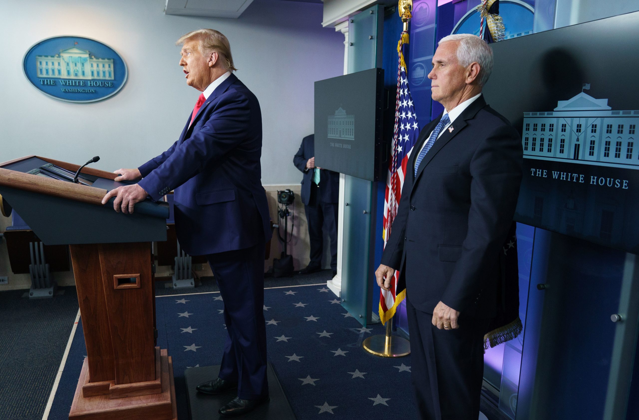 US President Donald Trump with Vice President Mike Pence (R), delivers remarks on the stock market during an unscheduled appearance in the Brady Briefing Room of the White House in Washington, DC on November 24, 2020. (Photo by MANDEL NGAN/AFP via Getty Images)