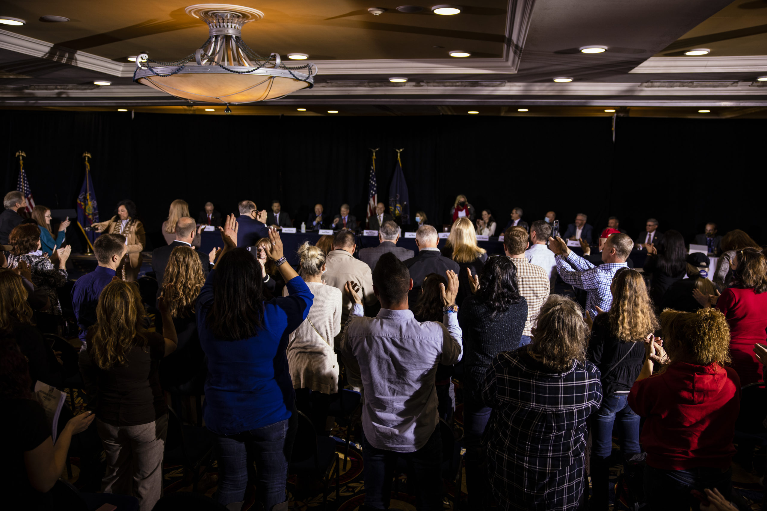 GETTYSBURG, PA - NOVEMBER 25: Supporters of President Donald Trump cheer as the Pennsylvania Senate Majority Policy Committee holds a public hearing Wednesday at the Wyndham Gettysburg Hotel to discuss the 2020 election issues and irregularities with President Trump's lawyer Rudy Giuliani on November 25, 2020 in Gettysburg, Pennsylvania. Giuliani is continuing his push to overturn election results in the courts. (Photo by Samuel Corum/Getty Images)