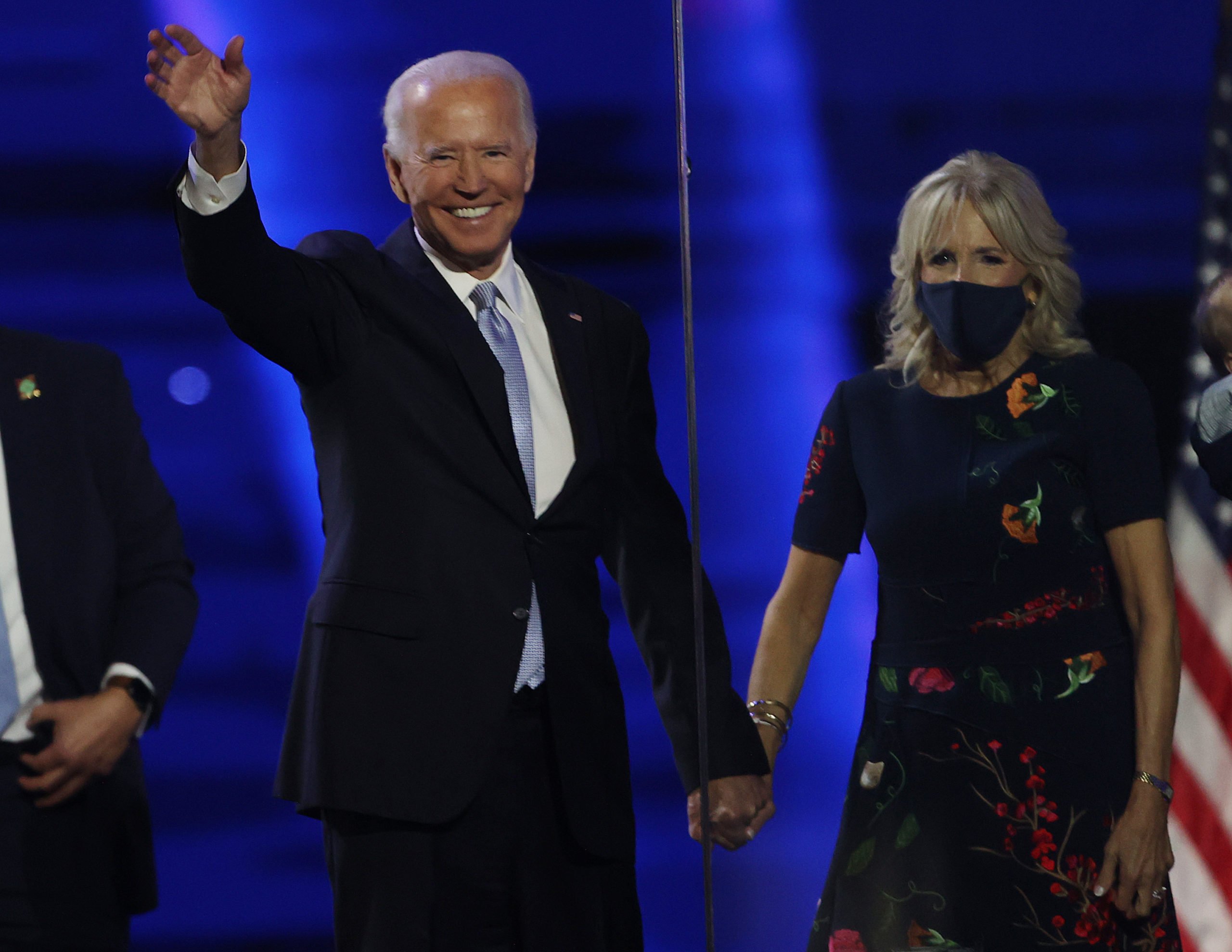 WILMINGTON, DELAWARE - NOVEMBER 07: President-elect Joe Biden and Jill Biden wave to the crowd after Biden's address to the nation from the Chase Center November 07, 2020 in Wilmington, Delaware. After four days of counting the high volume of mail-in ballots in key battleground states due to the coronavirus pandemic, the race was called for Biden after a contentious election battle against incumbent Republican President Donald Trump. (Photo by Tasos Katopodis/Getty Images)