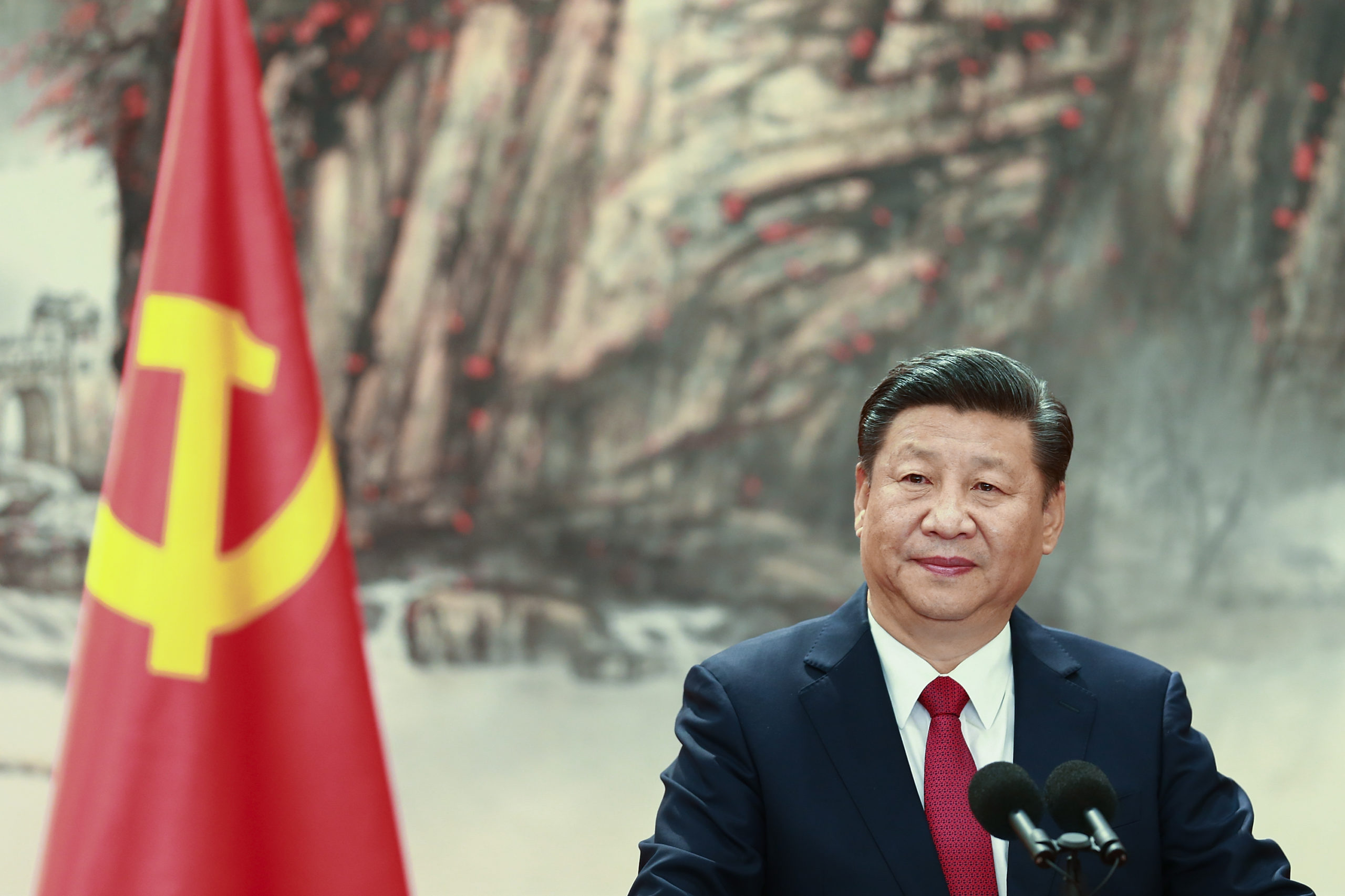 BEIJING, CHINA - OCTOBER 25: Chinese President Xi Jinping speaks at the podium during the unveiling of the Communist Party's new Politburo Standing Committee at the Great Hall of the People on October 25, 2017 in Beijing, China. China's ruling Communist Party today revealed the new Politburo Standing Committee after its 19th congress. (Photo by Lintao Zhang/Getty Images)