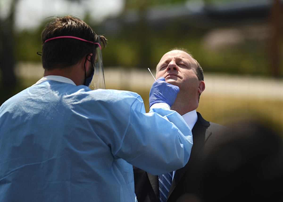 Colorado Governor Jared Polis gets a COVID-19 test at a new community testing site in Adams County at Water World on August 10, 2020 in Federal Heights, Colorado.(Photo by RJ Sangosti/MediaNews Group/The Denver Post via Getty Images)
