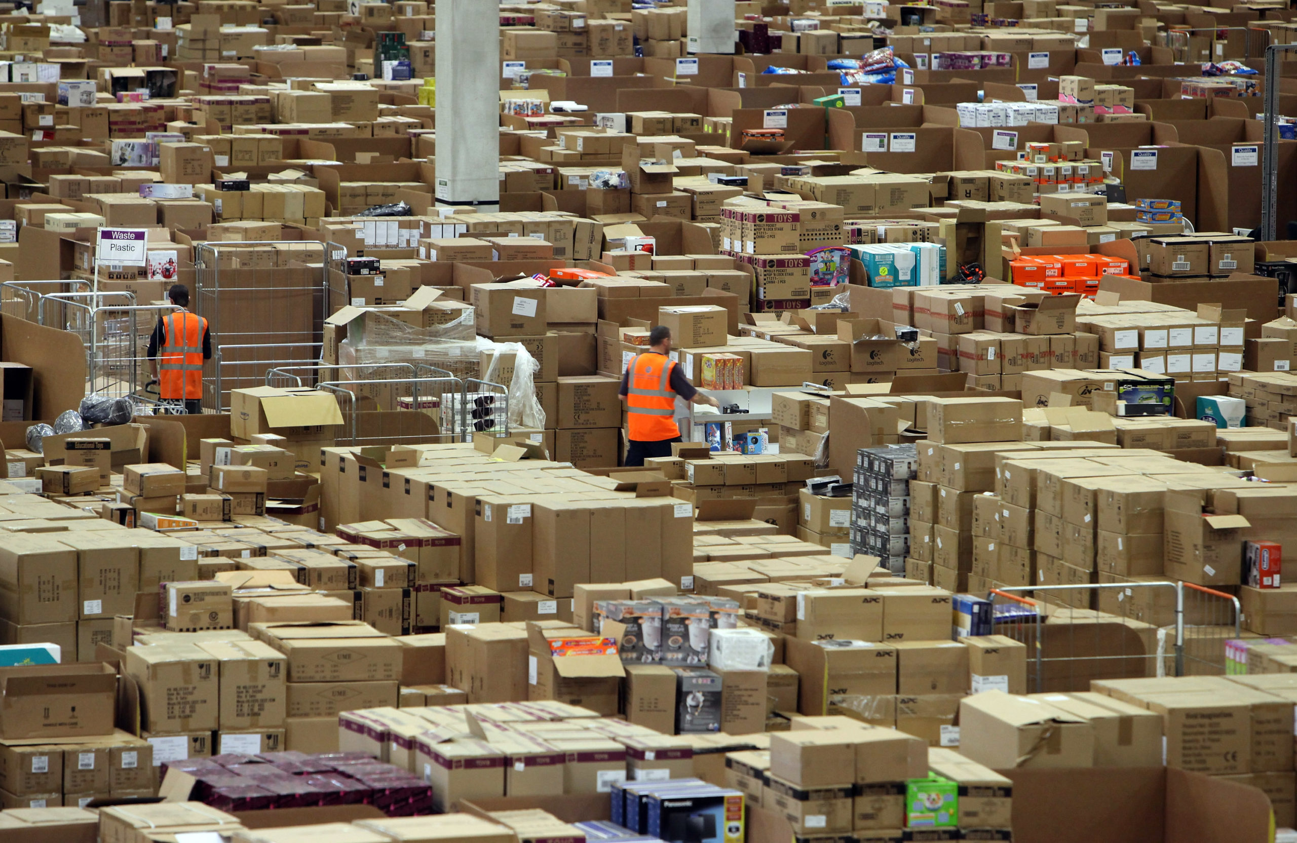 Staff at the Amazon Swansea fulfillment centre process orders as they prepare for what is expected to be their busiest Christmas on record on November 26, 2010 in Swansea, Wales. (Photo by Matt Cardy/Getty Images)